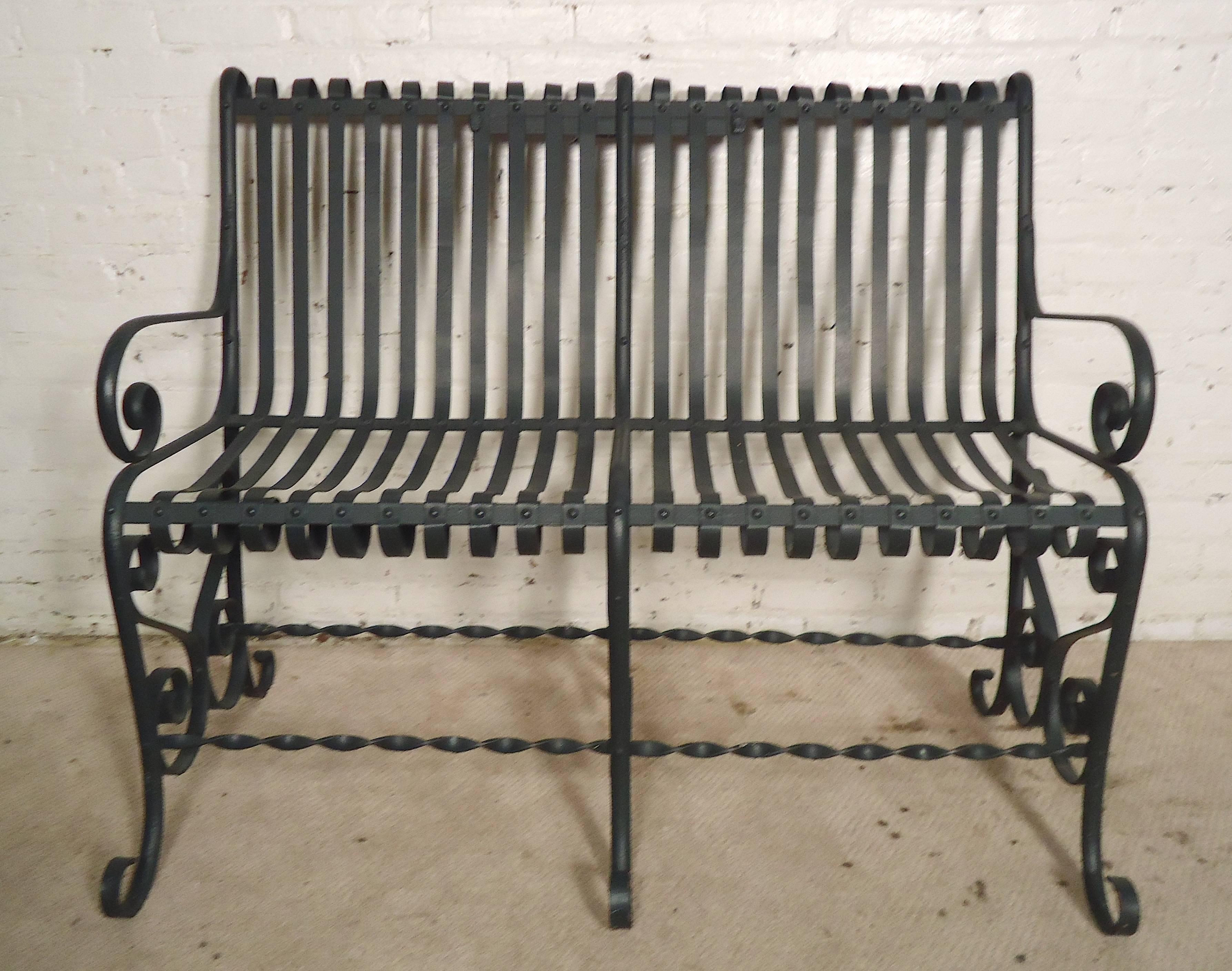 Four feet wide wrought iron bench with charming scrolling detail throughout. Comfortable back and seat, ornate trimming, forest green color.

 (Please confirm item location - NY or NJ - with dealer)
