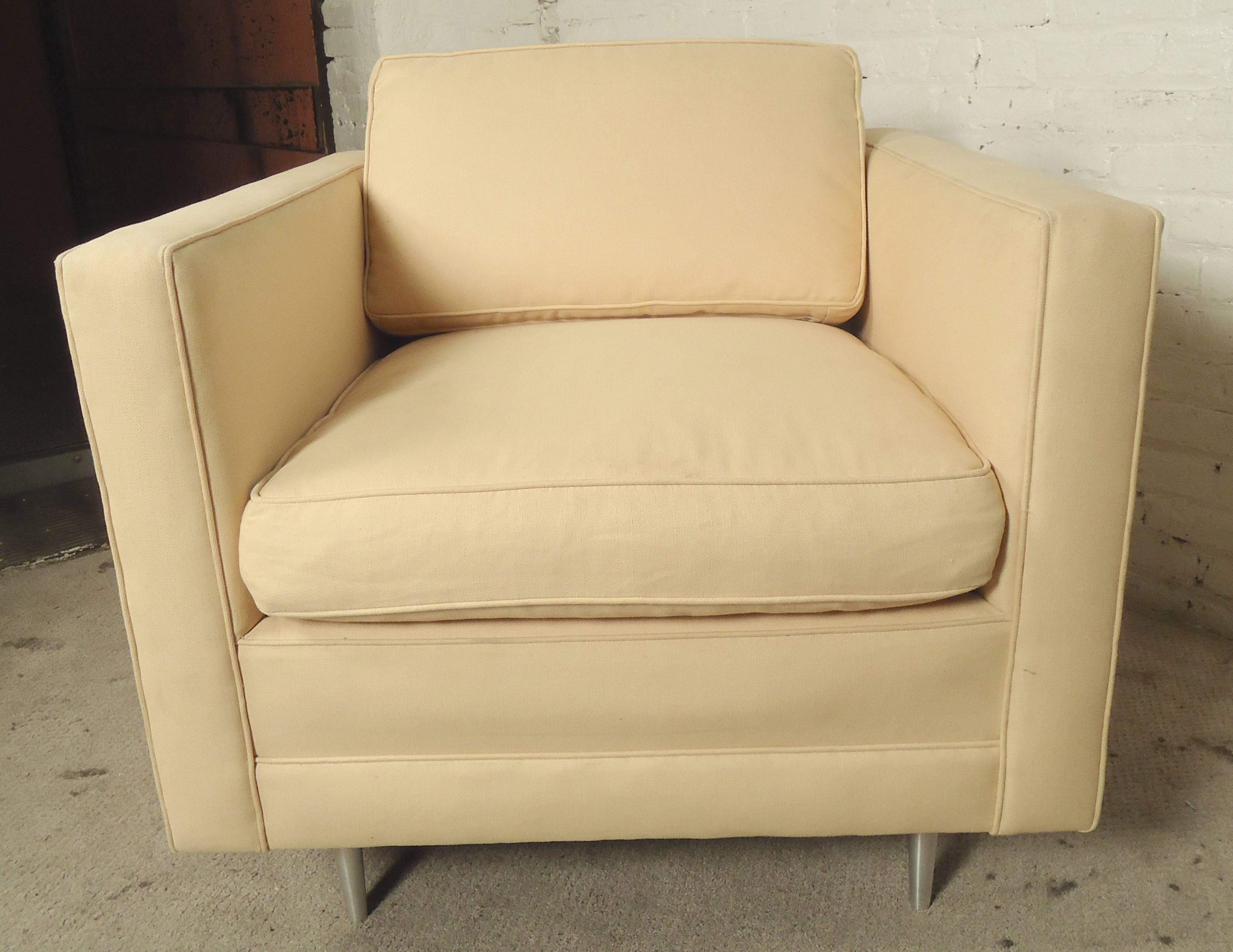 Square lounge chair with high arms and chrome feet. Large soft cushioning, beige upholstery.

(Please confirm item location - NY or NJ - with dealer)
