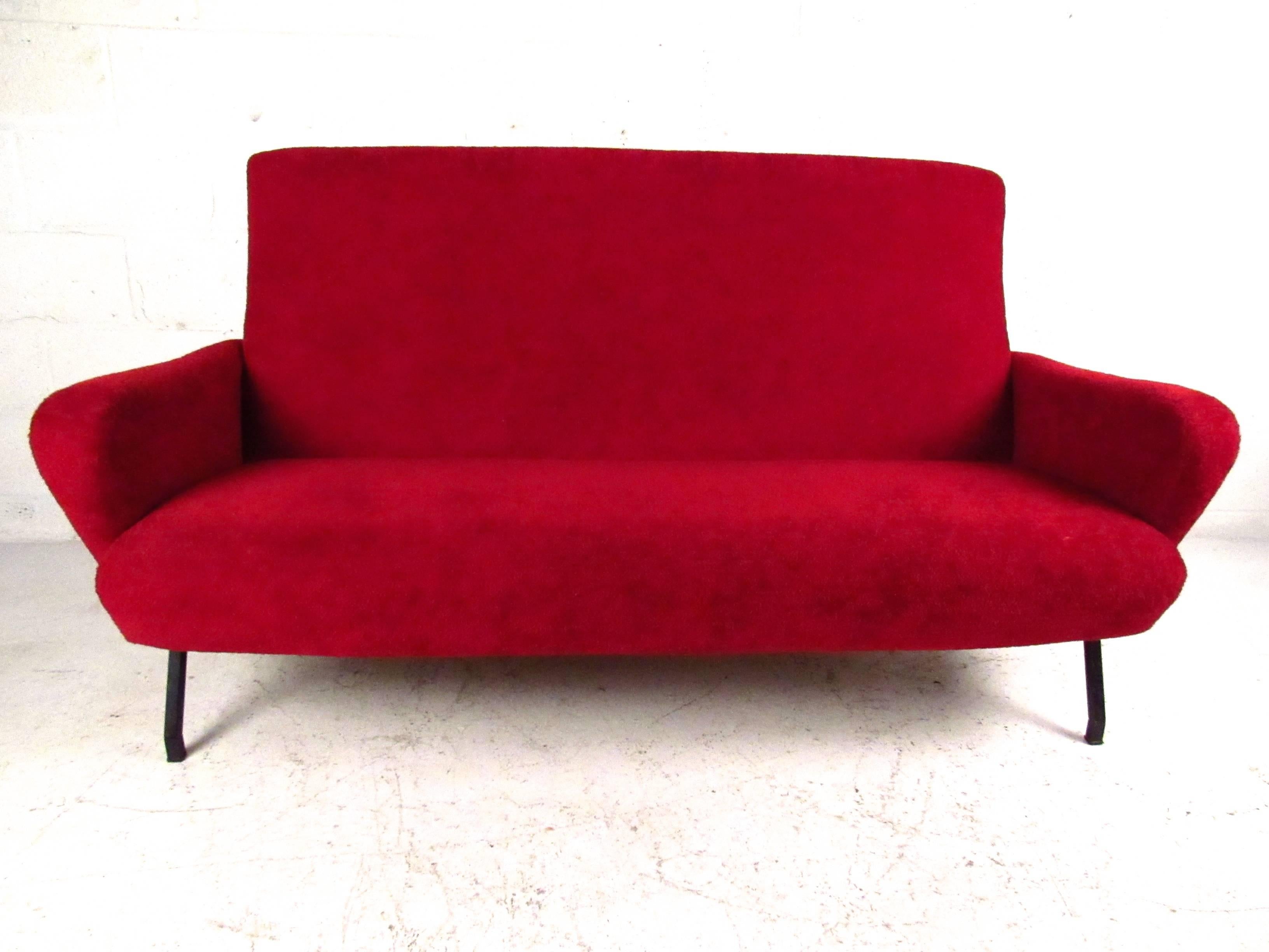 This beautiful Mid-Century sofa features vintage Italian design similar to both Marco Zanuso and Gio Ponti. Sculpted sides and contoured back combine with plush upholstery to make this sofa the perfect addition to any seating arrangement. Please