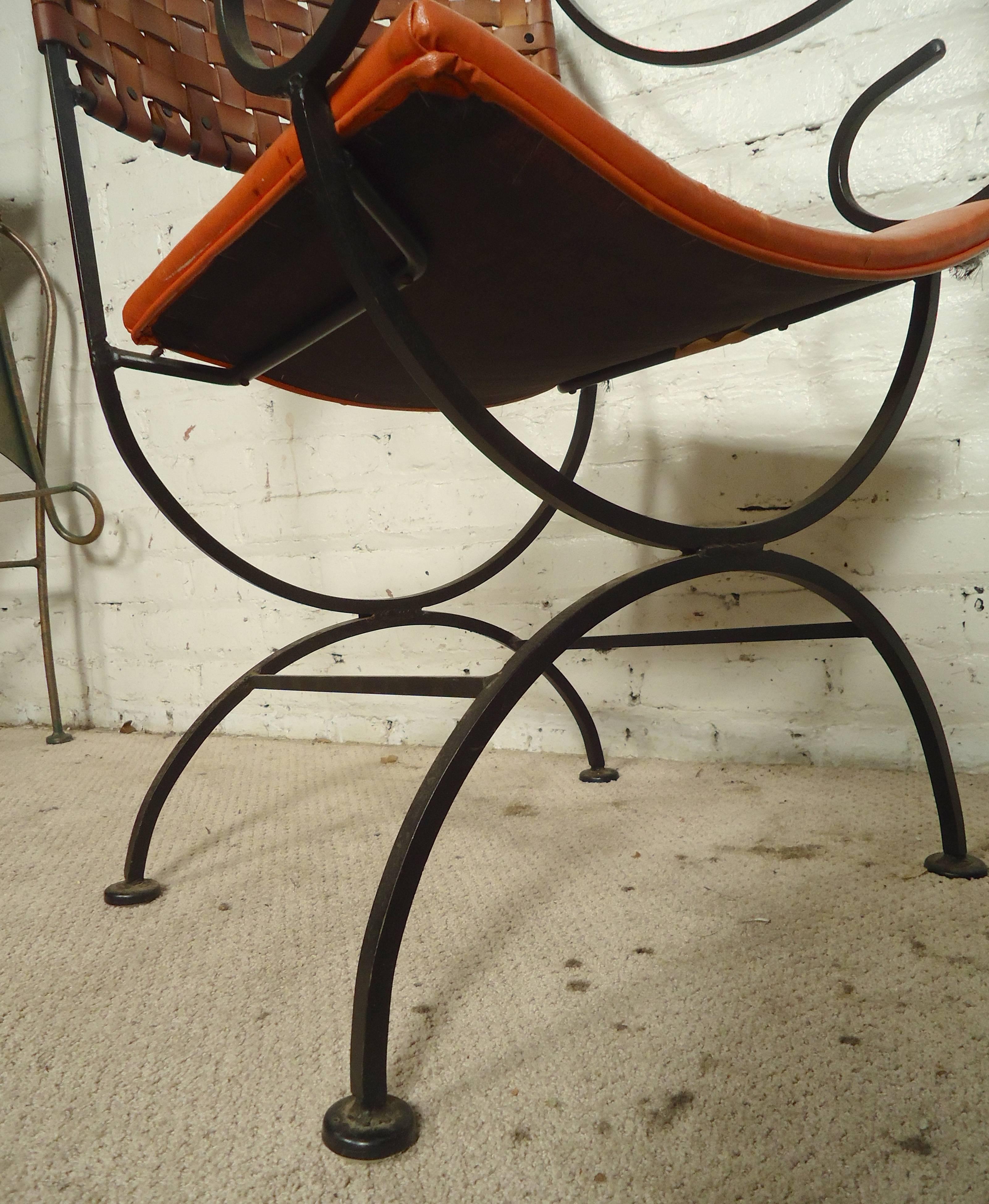 Pair of strong iron chairs with attractive scrolled arms and woven leather backs. Well made, sturdy arm chairs that are comfortable for both indoor and outdoor seating.

(Please confirm item location, NY or NJ, with dealer).
 