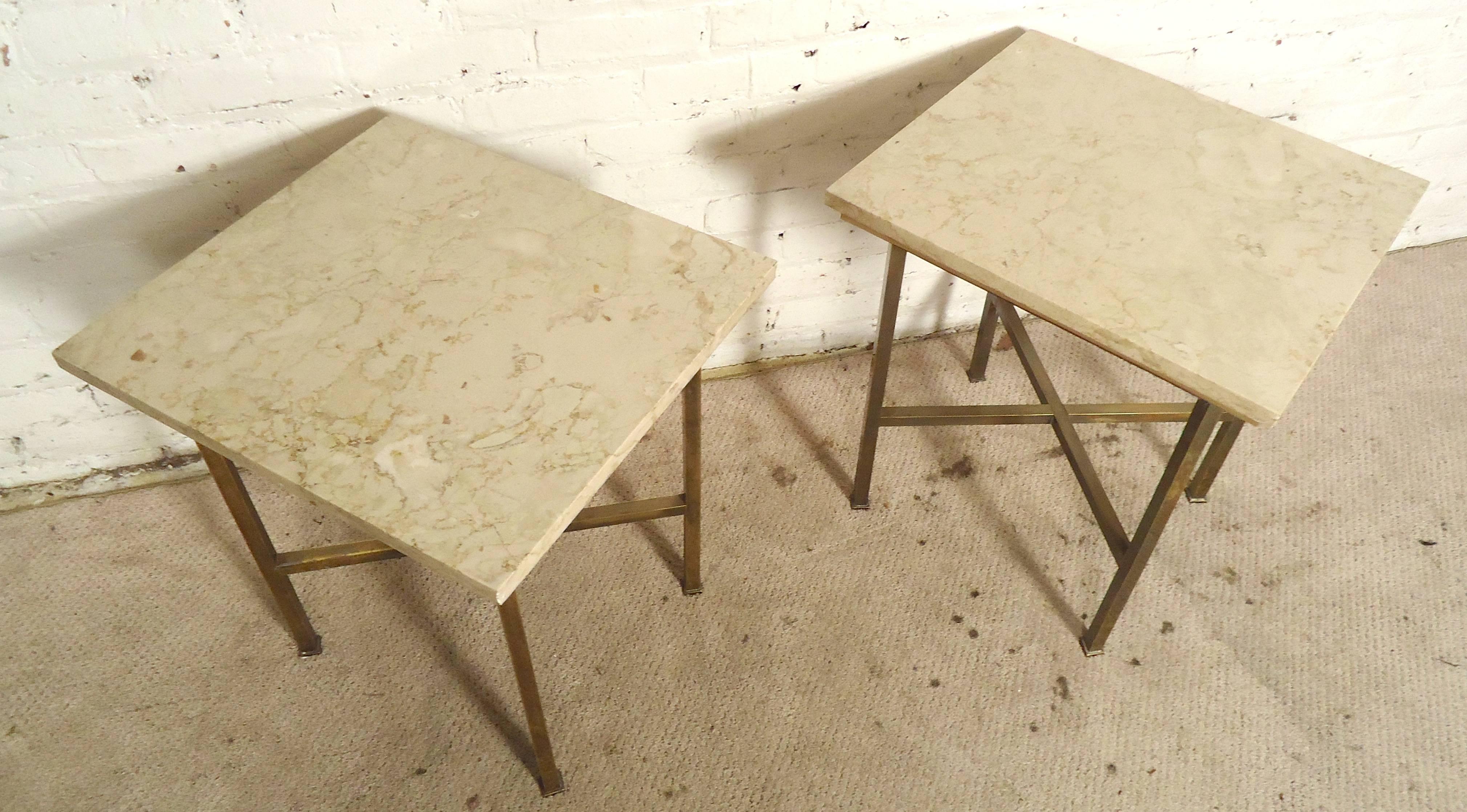 Pair of vintage modern tables with marble tops and strong brass bases. Simple square lines, great for your modern living room.

(Please confirm item location - NY or NJ - with dealer)
