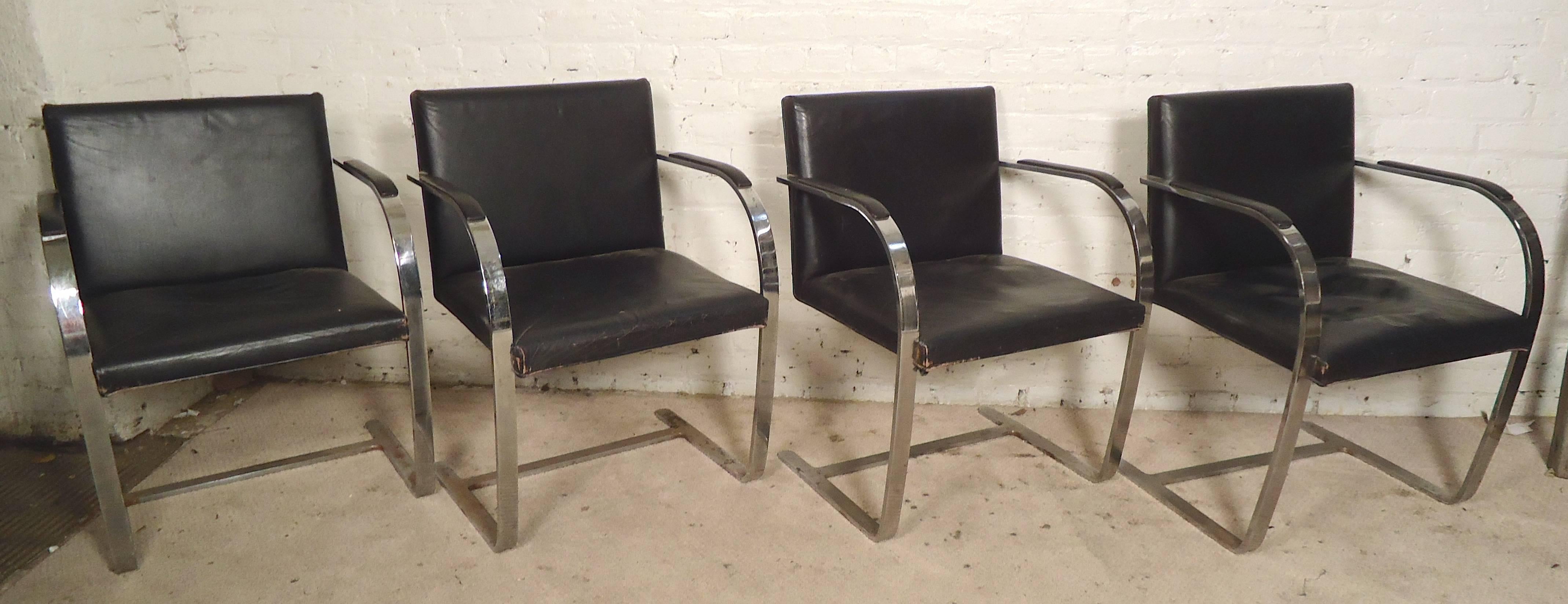 Ludwig Mies van der Rohe designed chrome-plated armchairs for Knoll. Great modern form with continuous arm to leg design. Heavy weight, comfortable 