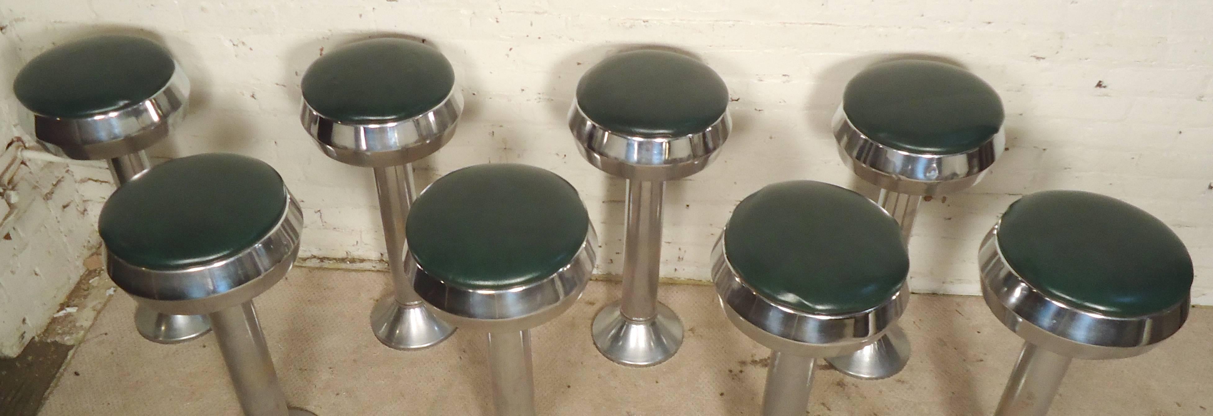 This set of swivel stools comes straight from the 1950's ice cream parlor. Heavy polished chrome and green vinyl seats. [PRICE IS FOR ONE]

(Please confirm item location - NY or NJ - with dealer)
