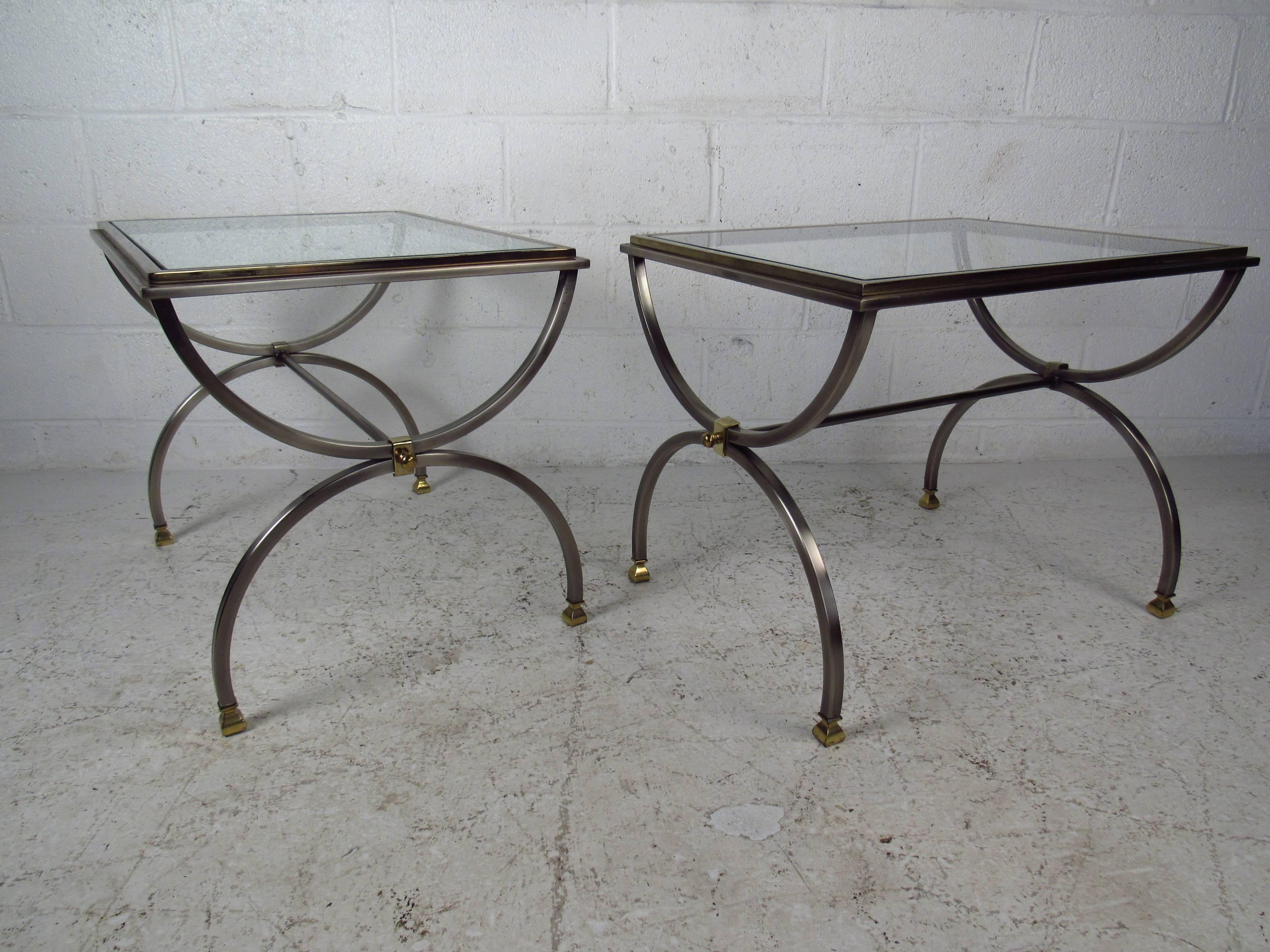 This beautiful pair of vintage end tables features a detailed base with unique curvatures in the frame. These stylish tables are perfect for use as end tables, side tables, or lamp tables, please confirm item location (NY or NJ).