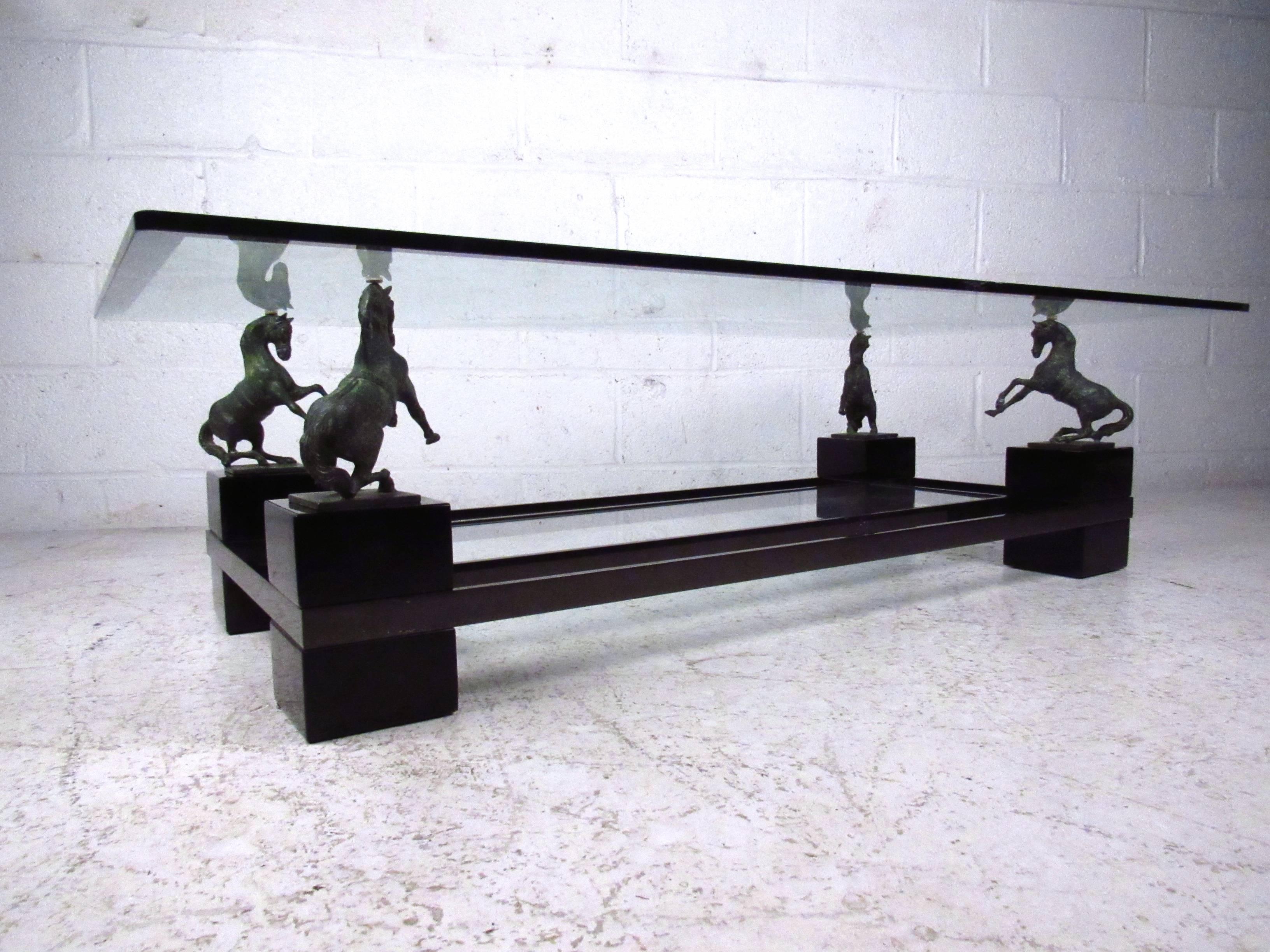 This beautiful coffee table features a thick beveled top supported by rearing bronze horses. Unique and sturdy two tier construction makes this a visually impressive piece in any setting. Please confirm item location (NY or NJ).