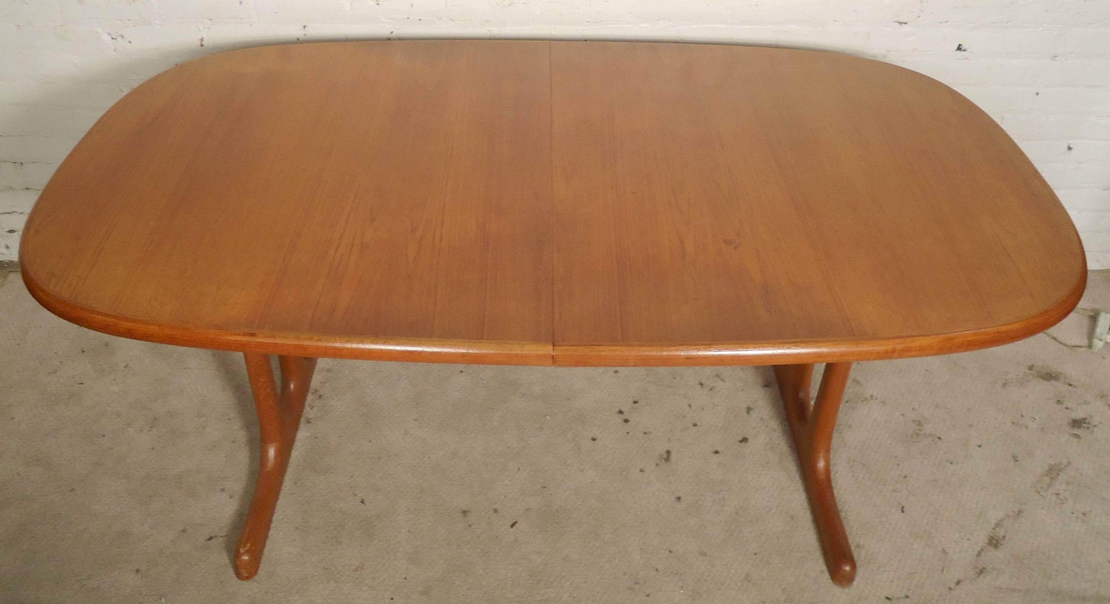 Mid-century modern teak table with two leaves that can open to nine feet long. Warm teak grain, rounded oval shape, trestle base. Great for parties of 4 to 10 people.

(Please confirm item location - NY or NJ - with dealer)
