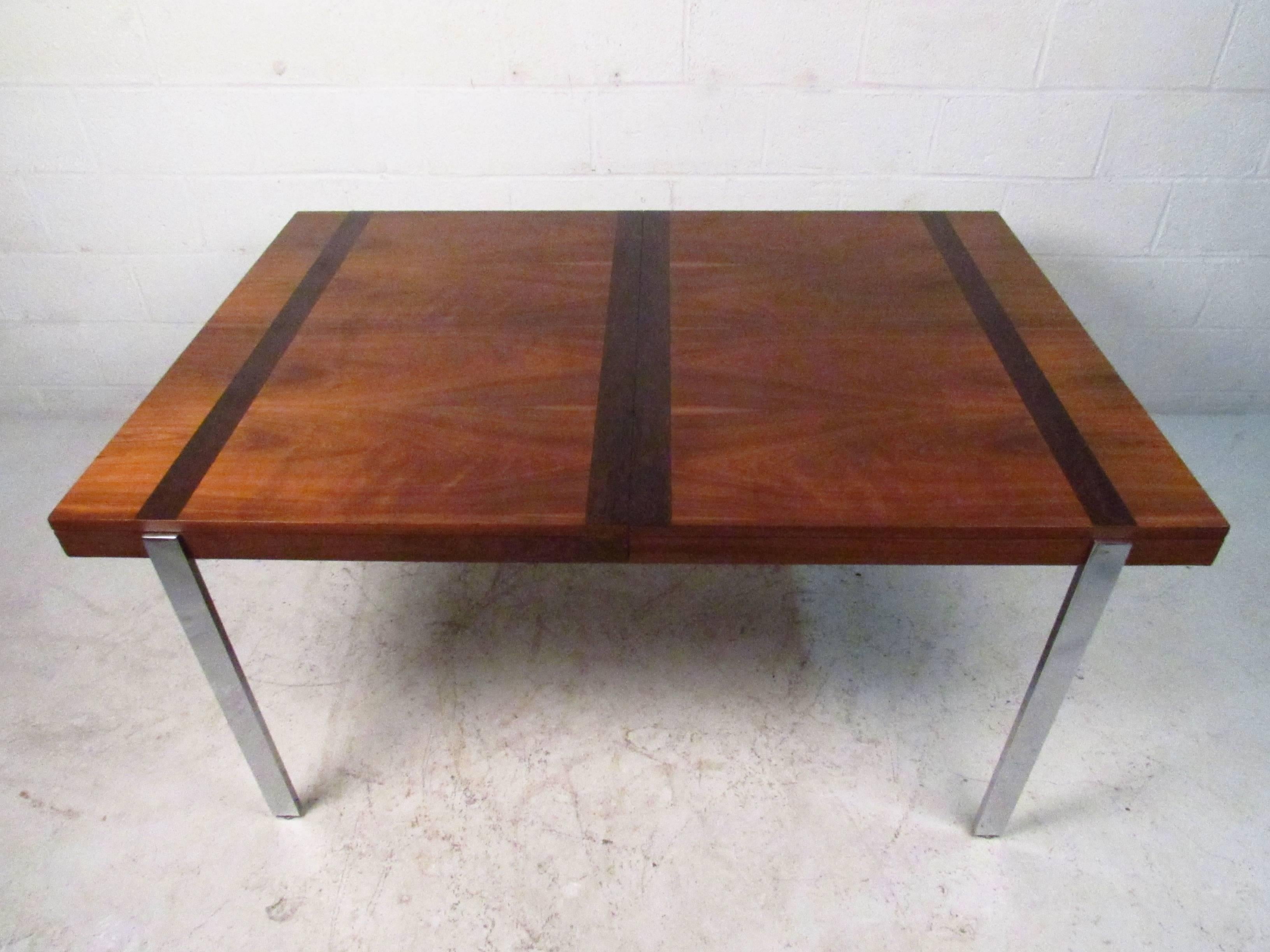 Vintage modern table by Lane with warm walnut grain accented by striking rosewood bands. Strong polished chrome legs add to the attractive modern look and make a lovely addition to kitchen, dining room, or small conference space. 

(Please confirm