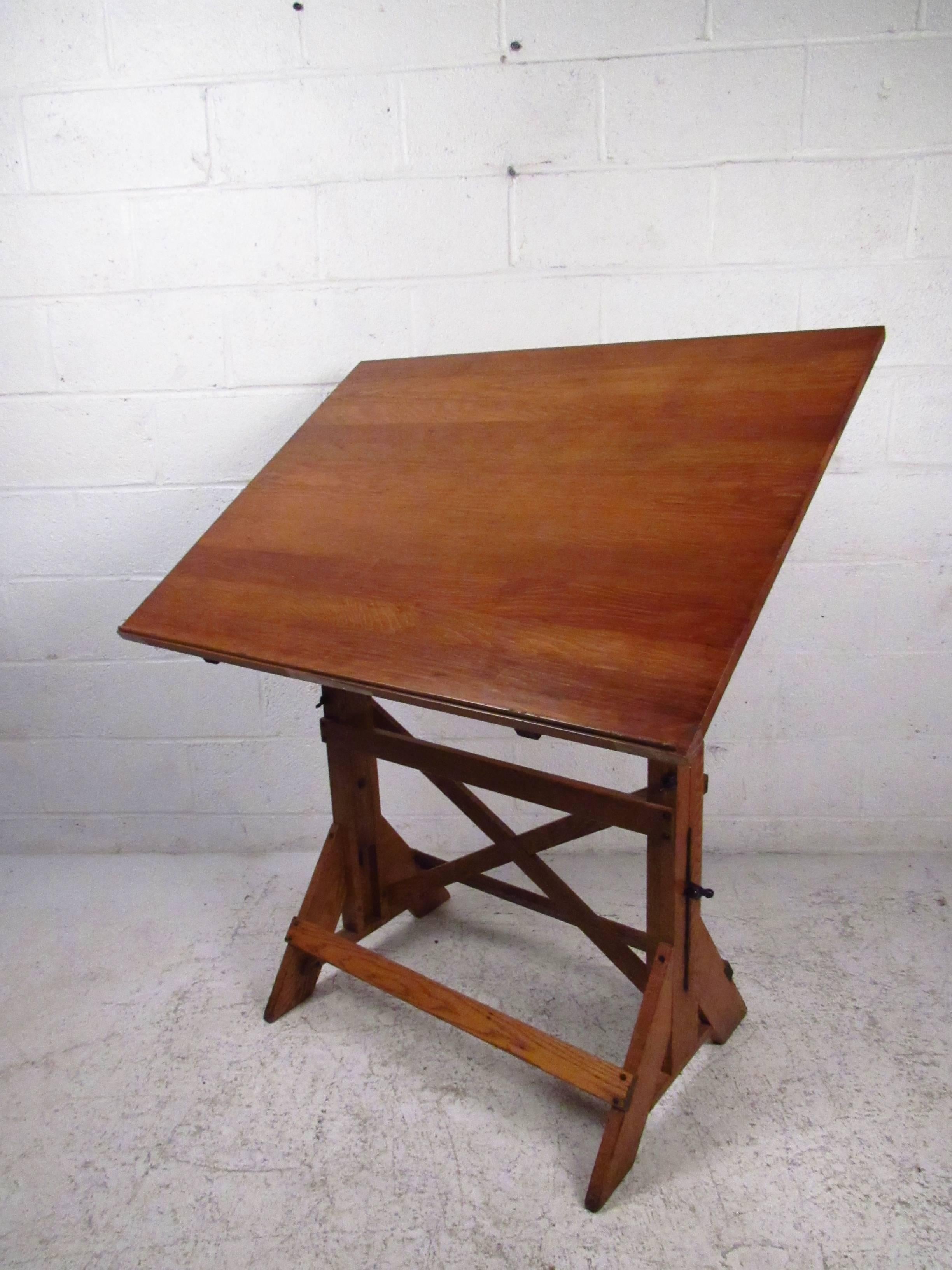 This vintage drafting table offers adjustable height and tilt, and makes a wonderful workspace for artists or students. Table extends from 32 inches high to 42.5 inches high, please confirm item location (NY or NJ). 