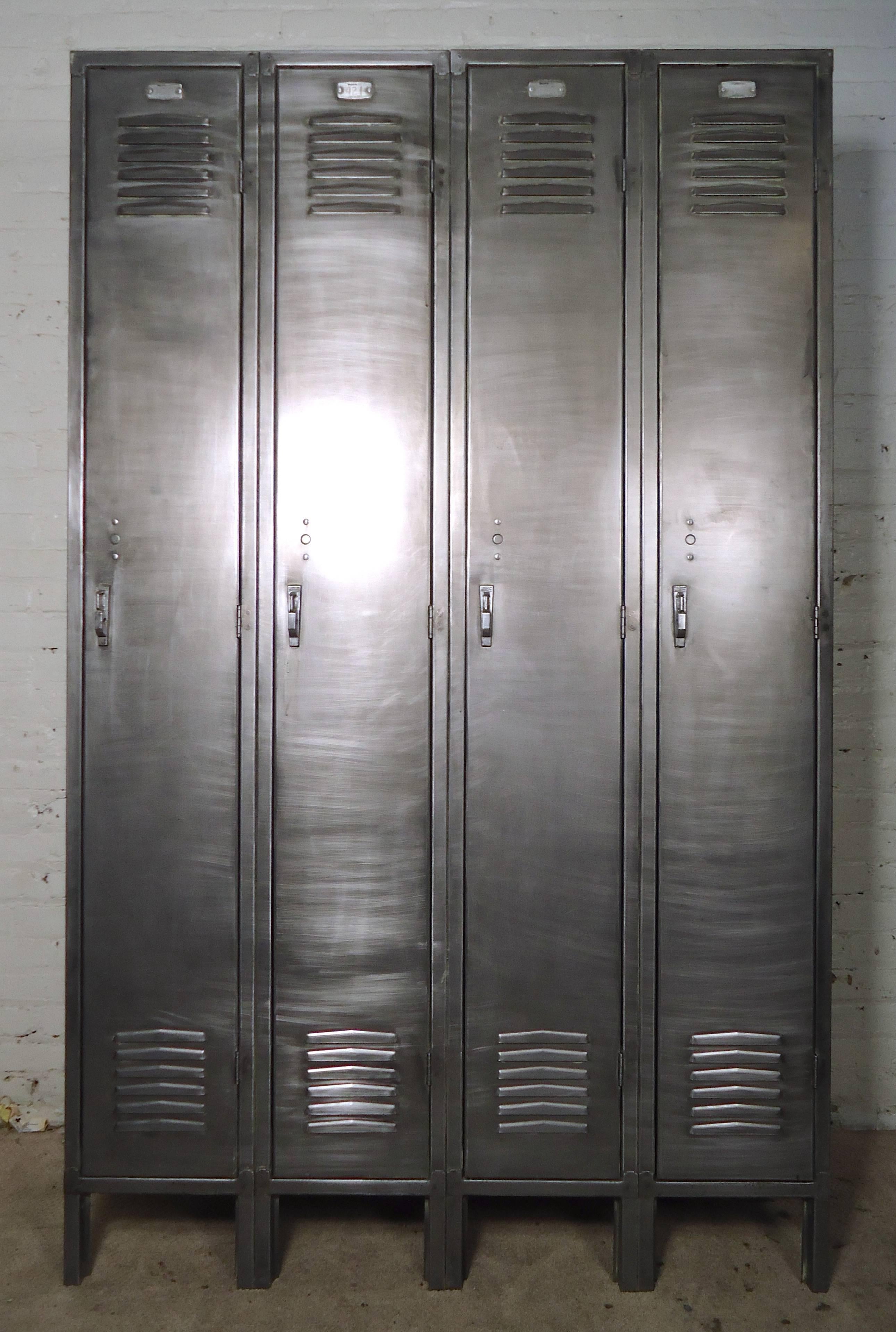 Tall standing locker with four units containing coat hooks and shelf. Outside has been restored in a bare metal style finish. Makes a unique closet for your modern home.

(Please confirm item location - NY or NJ - with dealer)
