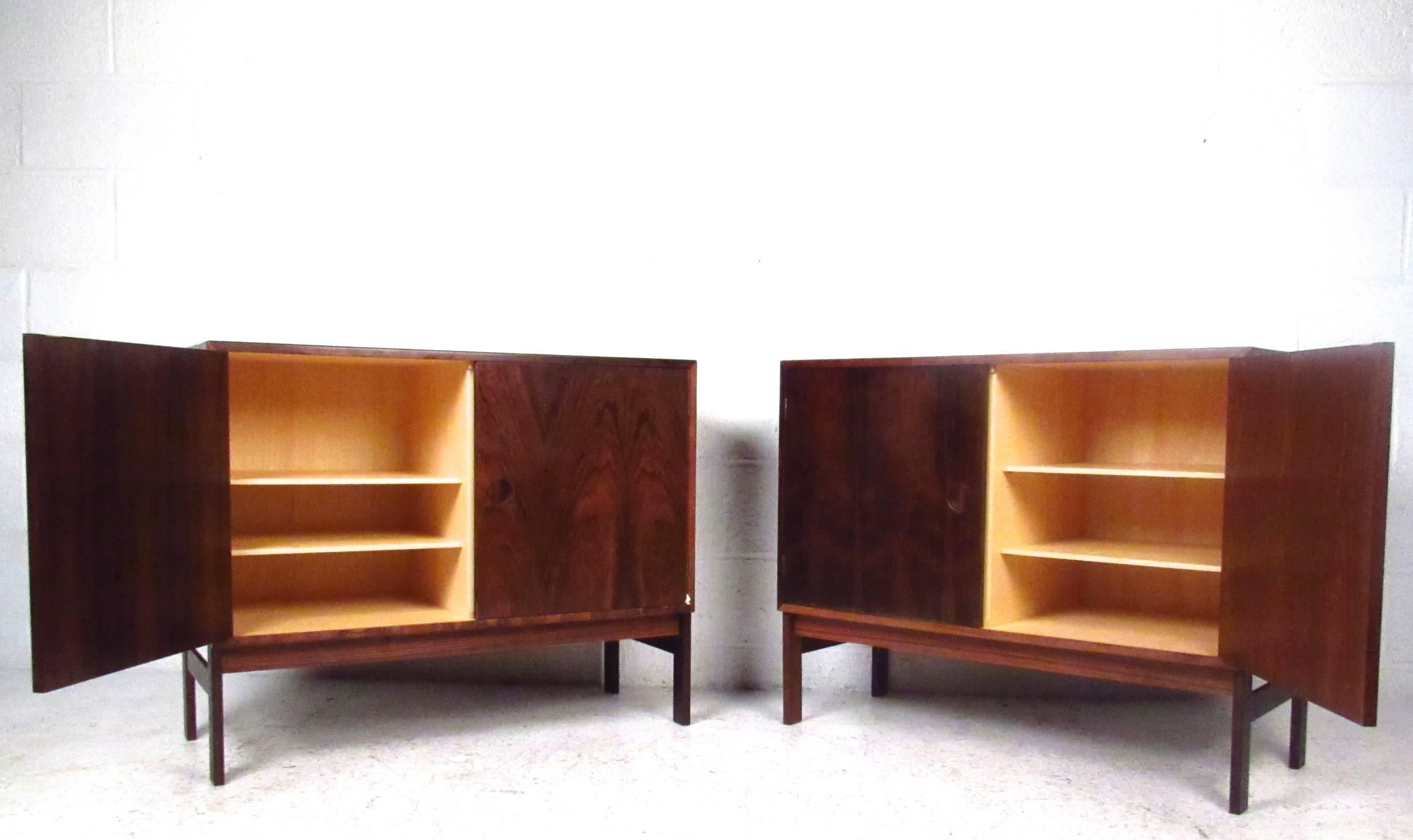 This beautiful vintage pair of cabinets are stamped by the manufacturer as made in Denmark and feature adjustable shelves, rich rosewood finish, and plenty of internal storage space. Please confirm item location (NY or NJ).