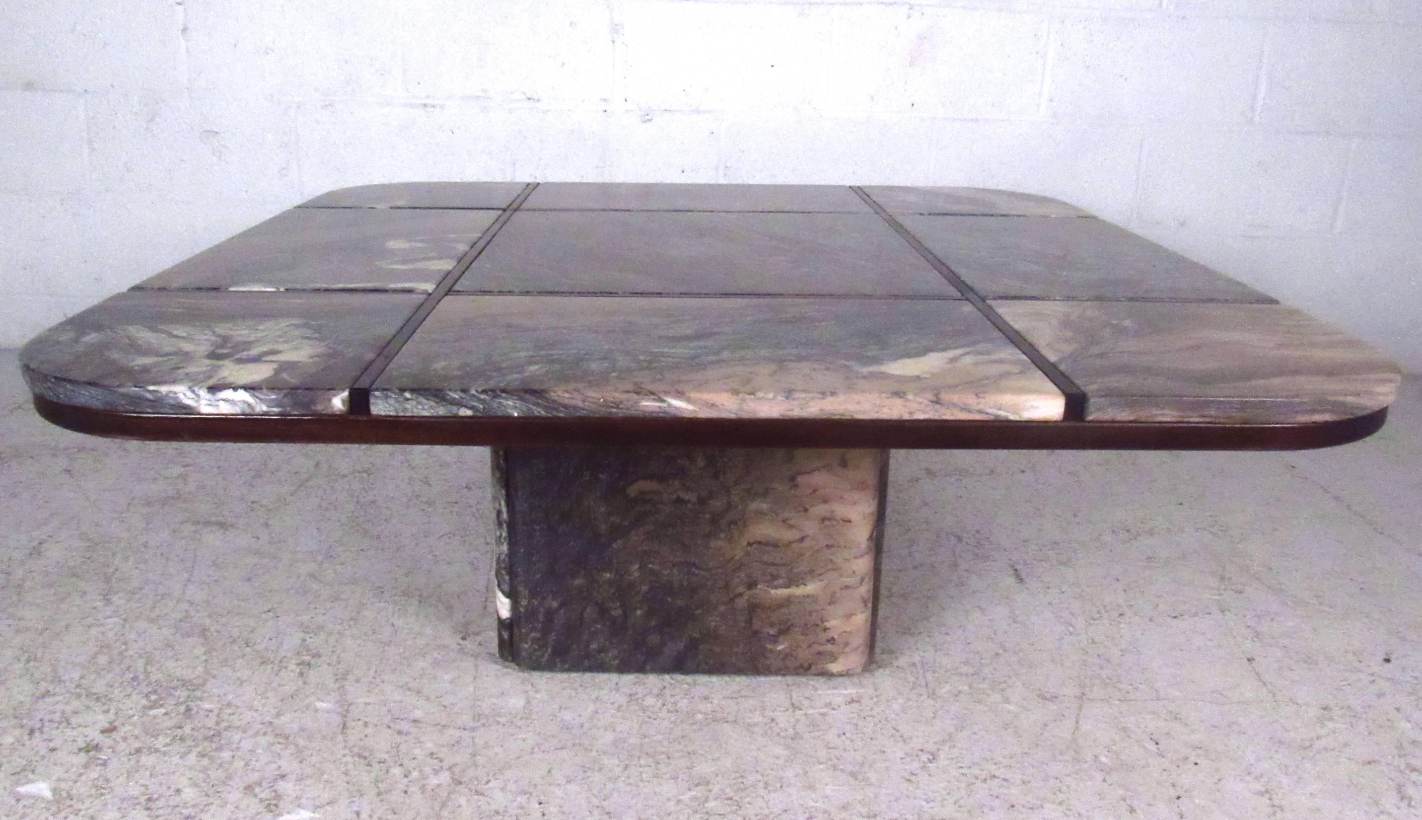 This beautiful midcentury coffee table is constructed by Danish design company Bendixen using quality Italian marble with rosewood inlay. Beautiful colors and unique design make this table the perfect addition to any interior. Please confirm item