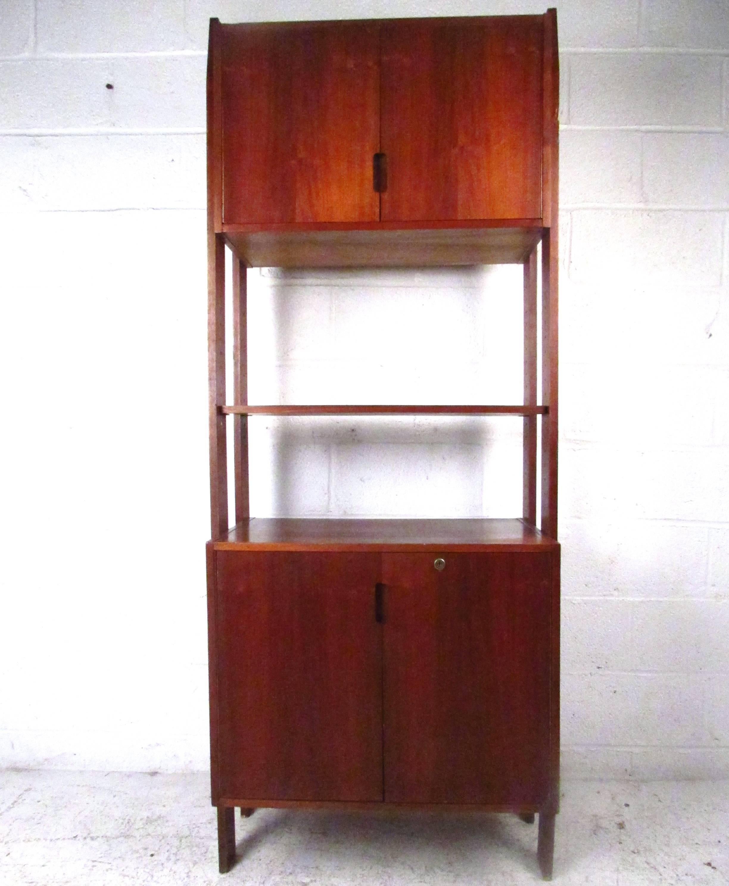 This vintage freestanding unit makes a wonderful addition to any home or office. Dual cabinets, including a lower record cabinet, make this ideal for mixed storage and display. Please confirm item location (NY or NJ).