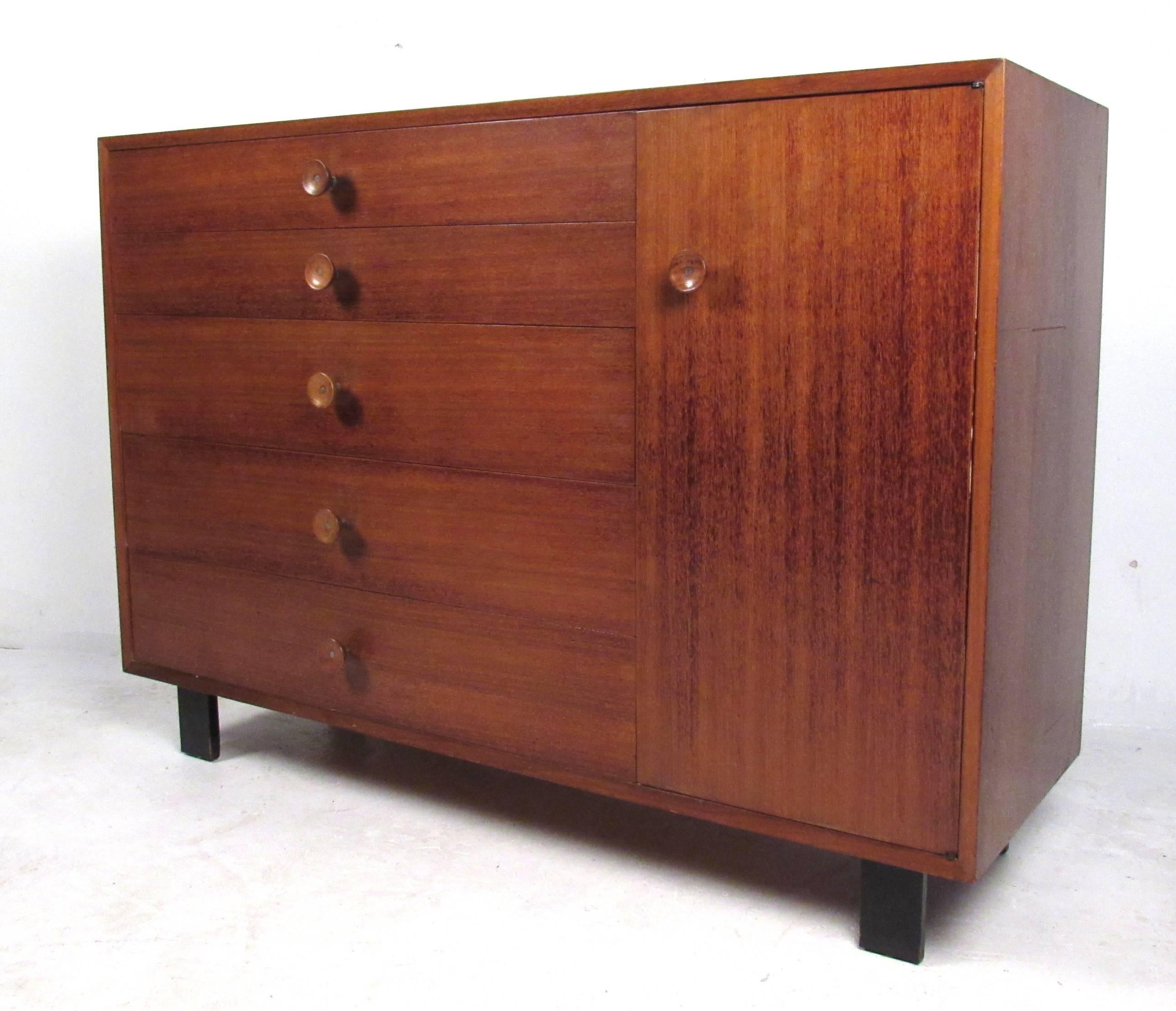 From Herman Miller's Basic Cabinet Series, a vintage George Nelson design with rare walnut & metal pulls. Please confirm item location (NY or NJ) with dealer.