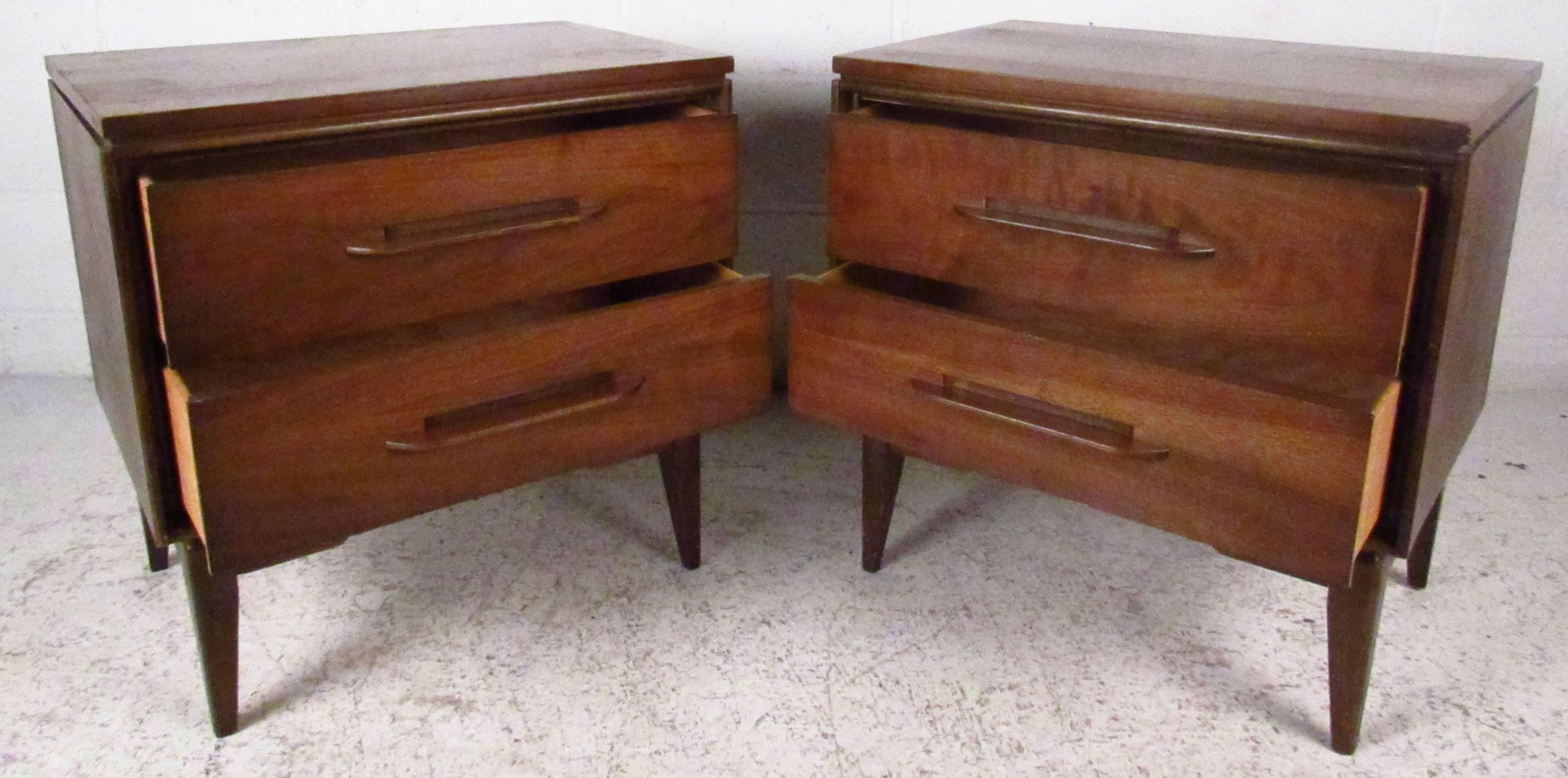 Two vintage-modern nightstands featuring sculpted handles, rich walnut grain and tapered legs. Manufactured by Bassett Furniture.

Please confirm item location NY or NJ with dealer.