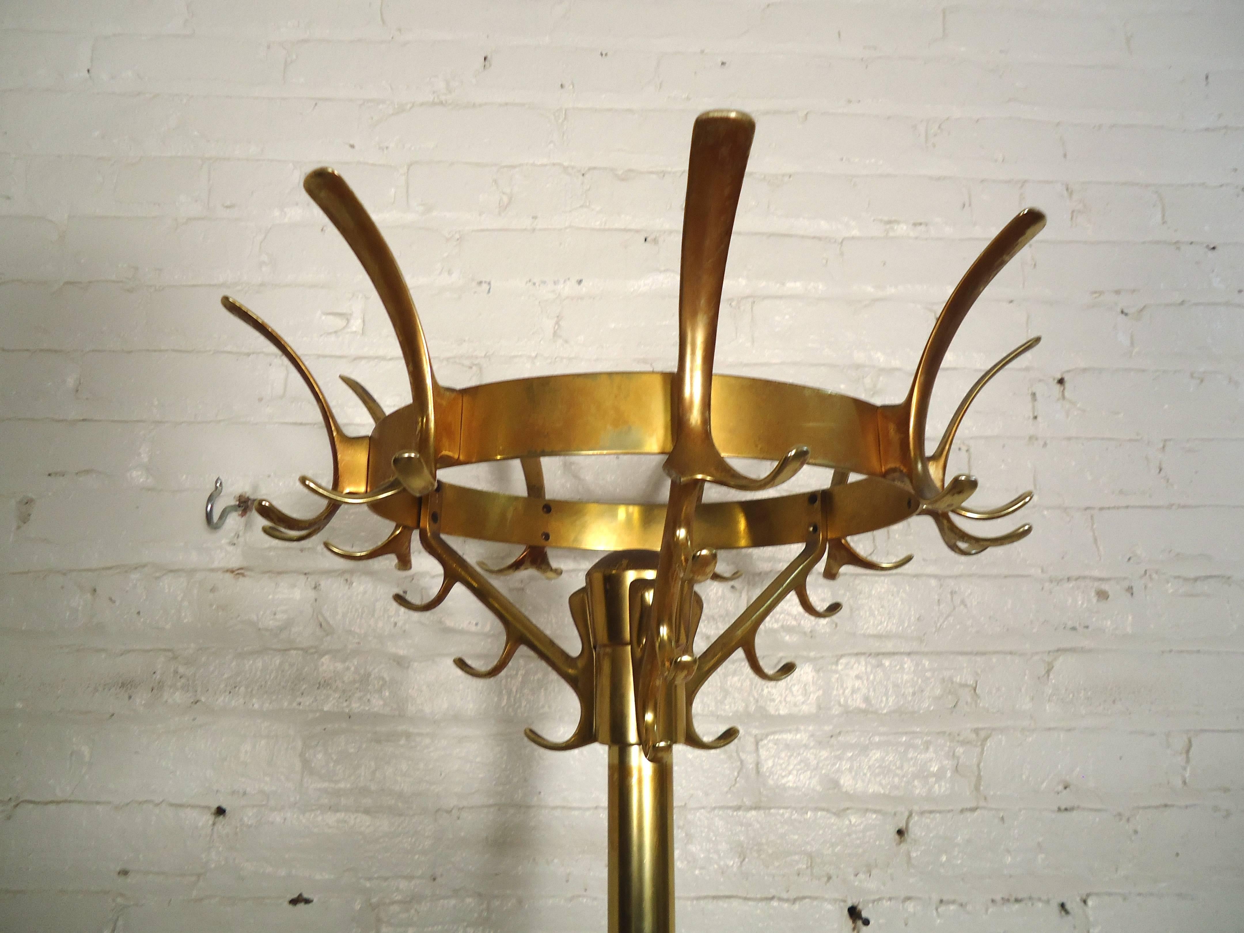 Beautiful vintage coat rack with scooping brass hooks and round umbrella holder.

(Please confirm item location - NY or NJ - with dealer)
