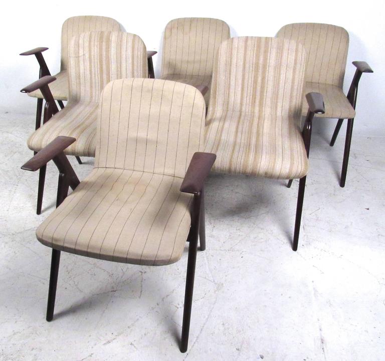 This set of six sculptural frame dining chairs features exquisite Mid-Century hardwood frames, wonderfully tapered and comfortable designed. Unique pointed legs and armrests add to the charm of these vintage Italian dining chairs. Please confirm