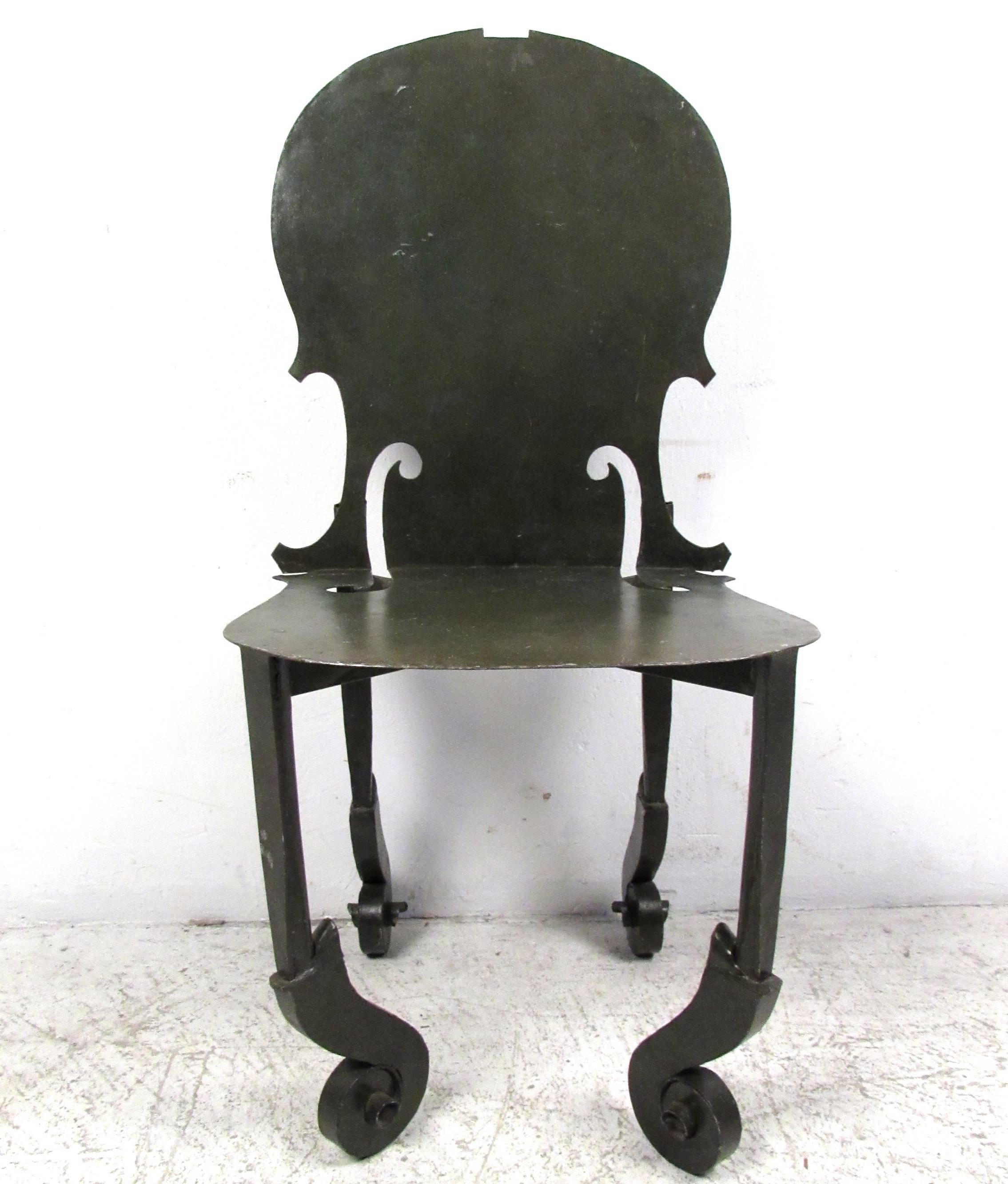 This unique vintage side chair features the unique design of Fernandez Arman, drawing inspiration from the violin. Unique feet resemble the instruments headstock while the seat and back feature cutaways similar to the body style. Please confirm item