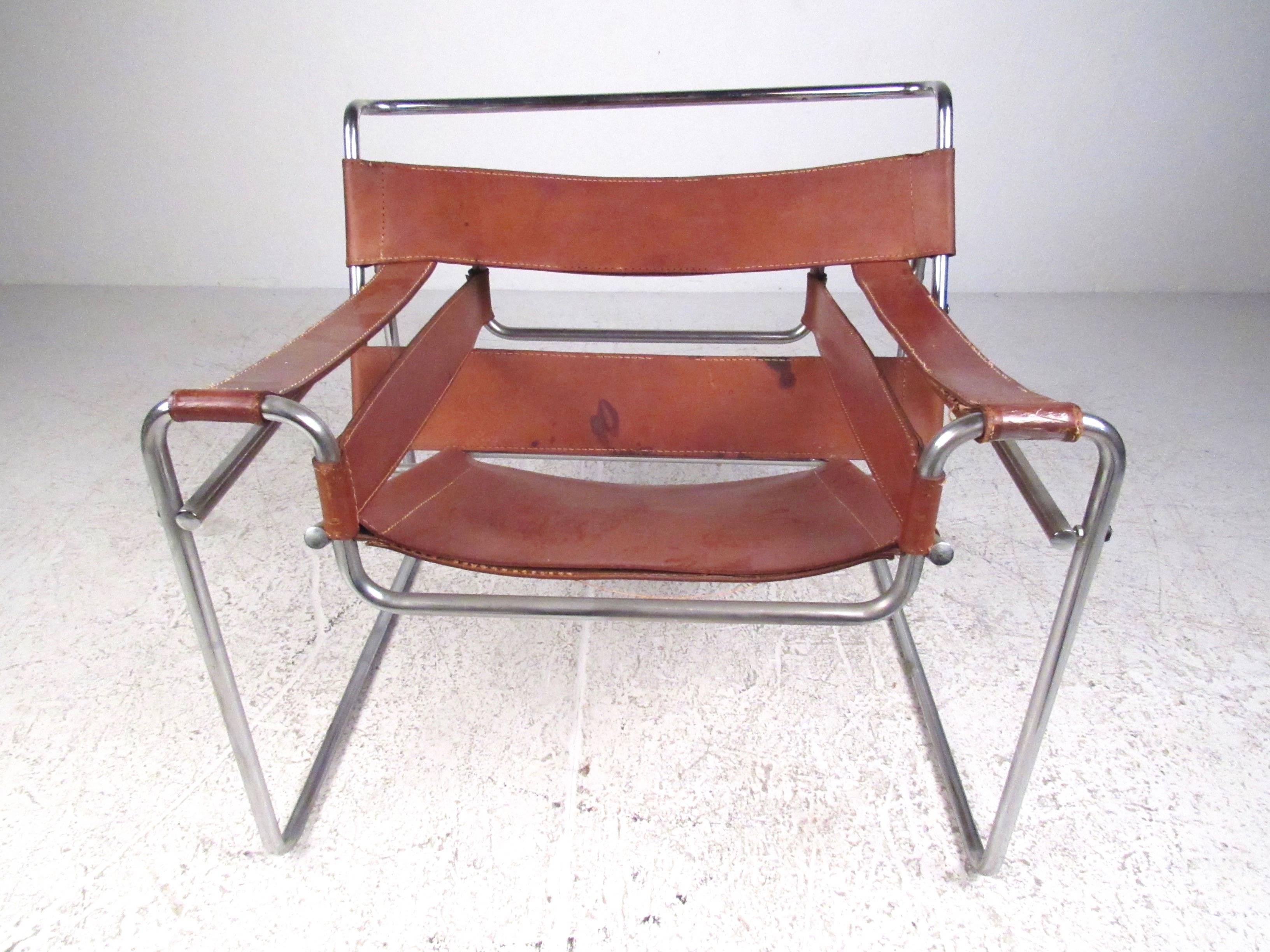 This vintage chrome and leather chair features style similar to Mid-Century Modern design of Marcel Bruer for Knoll, and makes a comfortable and stylish addition to any room. Please confirm item location (NY or NJ.)