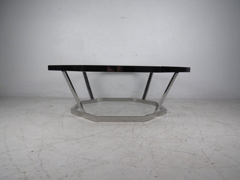 Well crafted octagonal coffee table attributed to Milo Baughman features heavy weight chrome and glass top. Perfect center table for home or business seating area. Please confirm item location (NY or NJ).