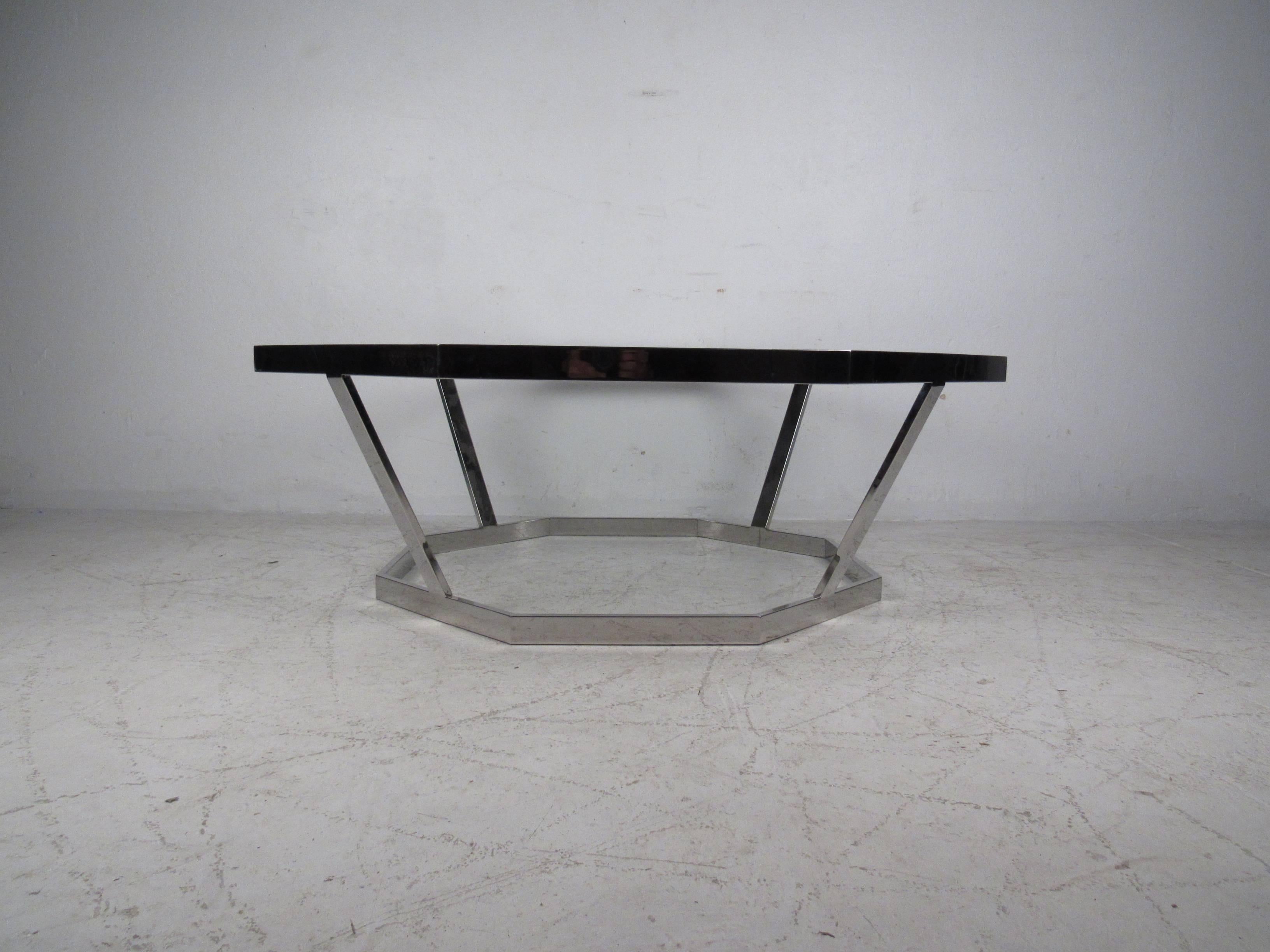 Well crafted octagonal coffee table attributed to Milo Baughman features heavy weight chrome and glass top. Perfect center table for home or business seating area. Please confirm item location (NY or NJ).