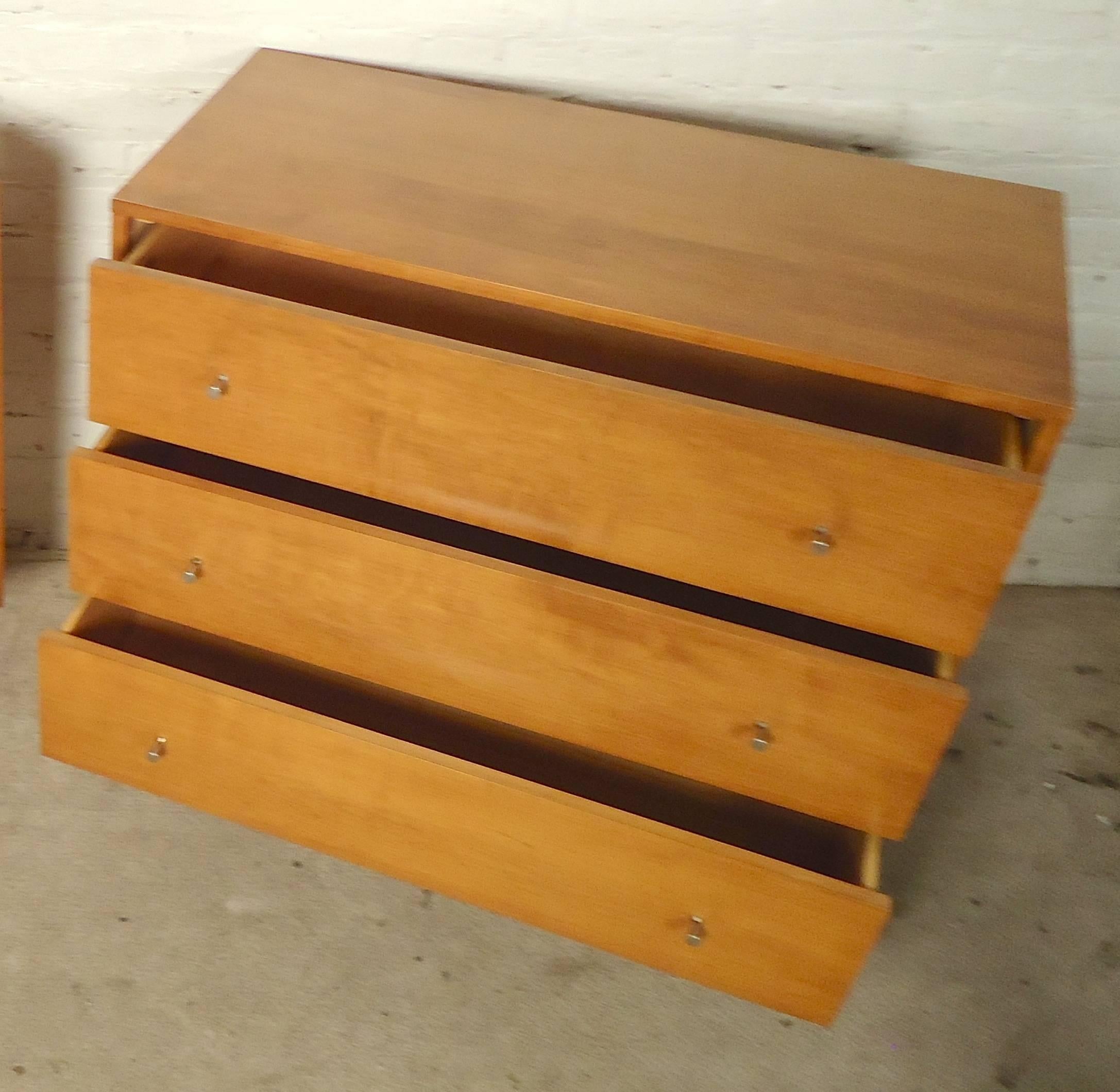 Paul McCobb designed furniture with blonde maple wood grain, classic cone legs and golf tee drawer pulls. 

(Please confirm item location - NY or NJ - with dealer).
