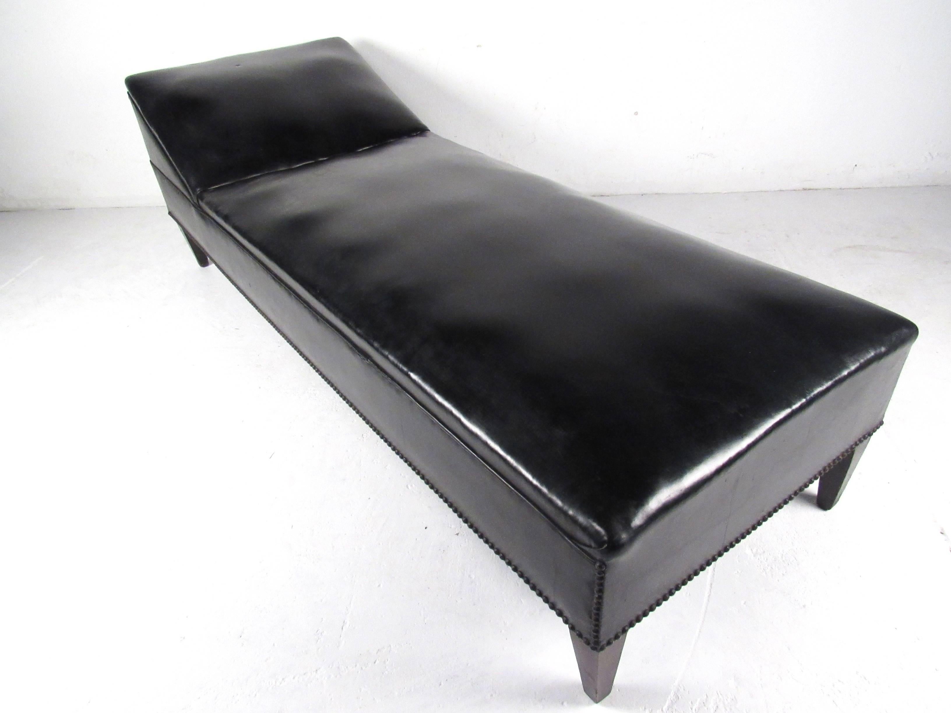 This beautiful black vinyl daybed features a vintage style designed for optimal comfort. The unique design of this piece makes an impressive and substantial addition to home or office. Please confirm location (NY or NJ).