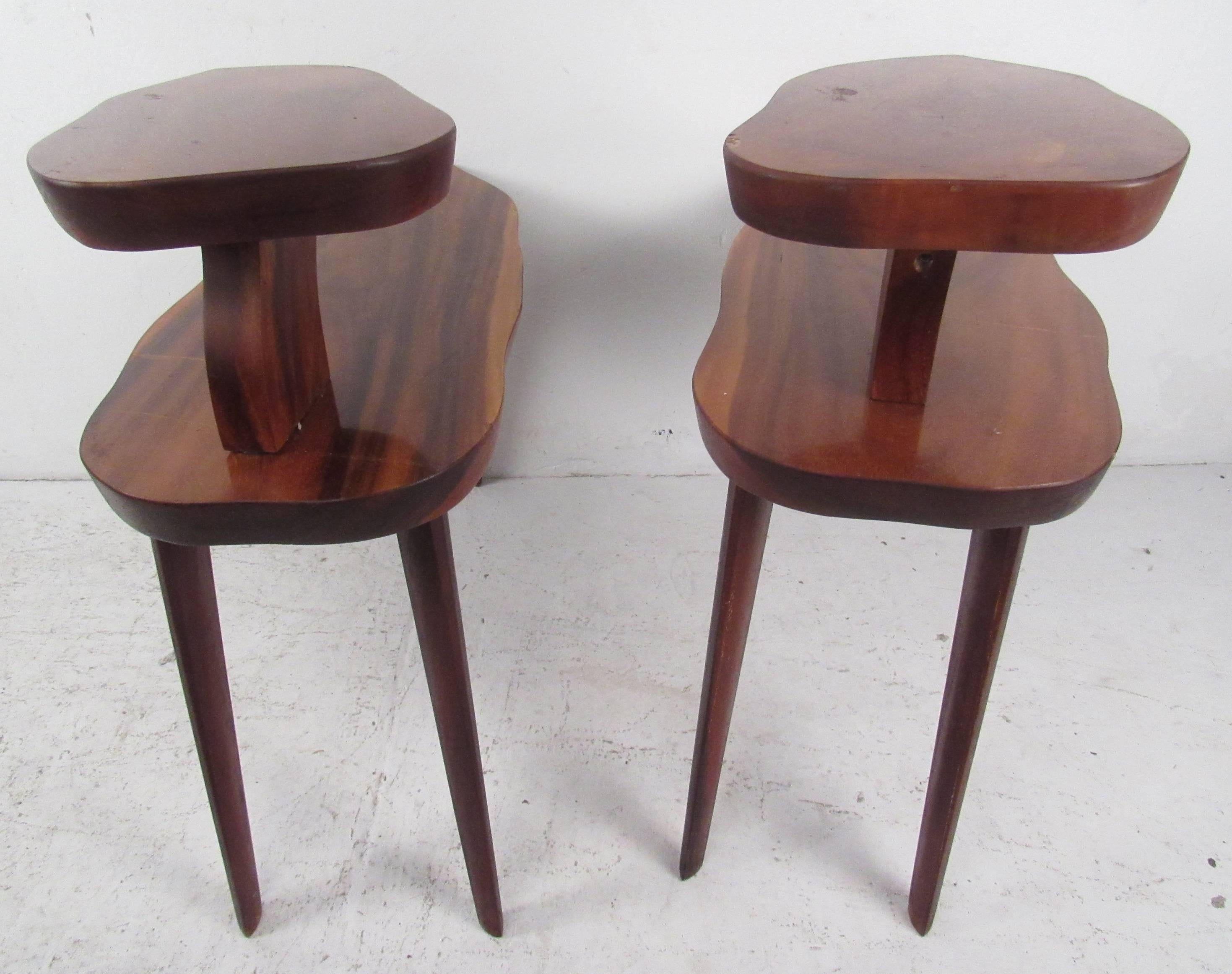 Pair of studio-made two-tier walnut end tables with tapered legs. 

Please confirm item location (NY or NJ) with dealer.
