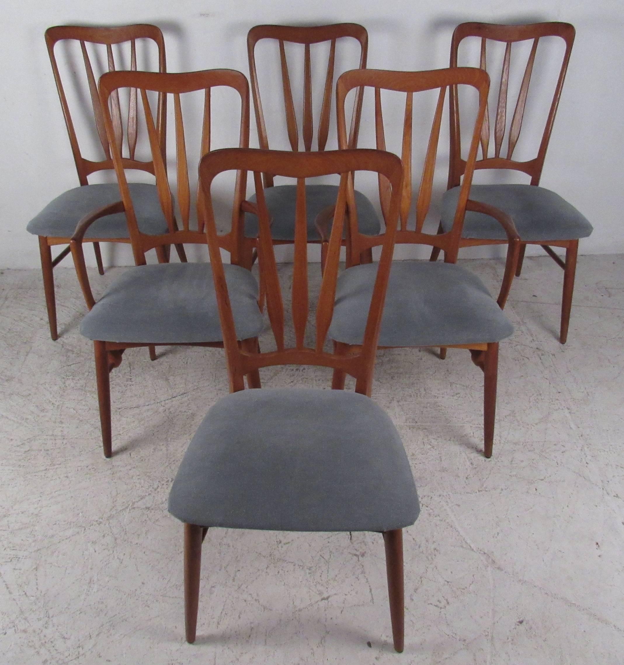 Set of six Danish modern dining chairs attributed to Folke Ohlsson make an impressive sculptural addition to dining room or kitchen seating. Exquisite Scandinavian Modern design includes shapely seat backs and comfortable proportions. Please confirm