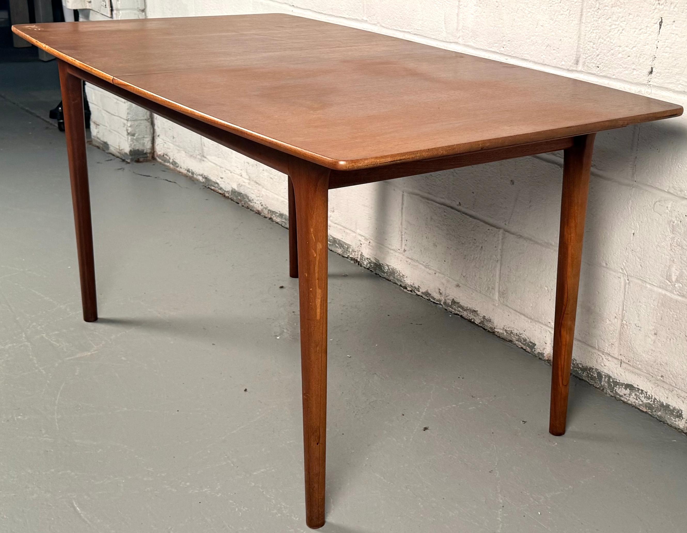 Elevate your dining space with this beautifully restored A.H. McIntosh teak extendable dining table, a stylish marriage of Scottish craftsmanship and mid-century Scandinavian design, crafted in Kirkcaldy, Scotland in the 1960s.

Please confirm