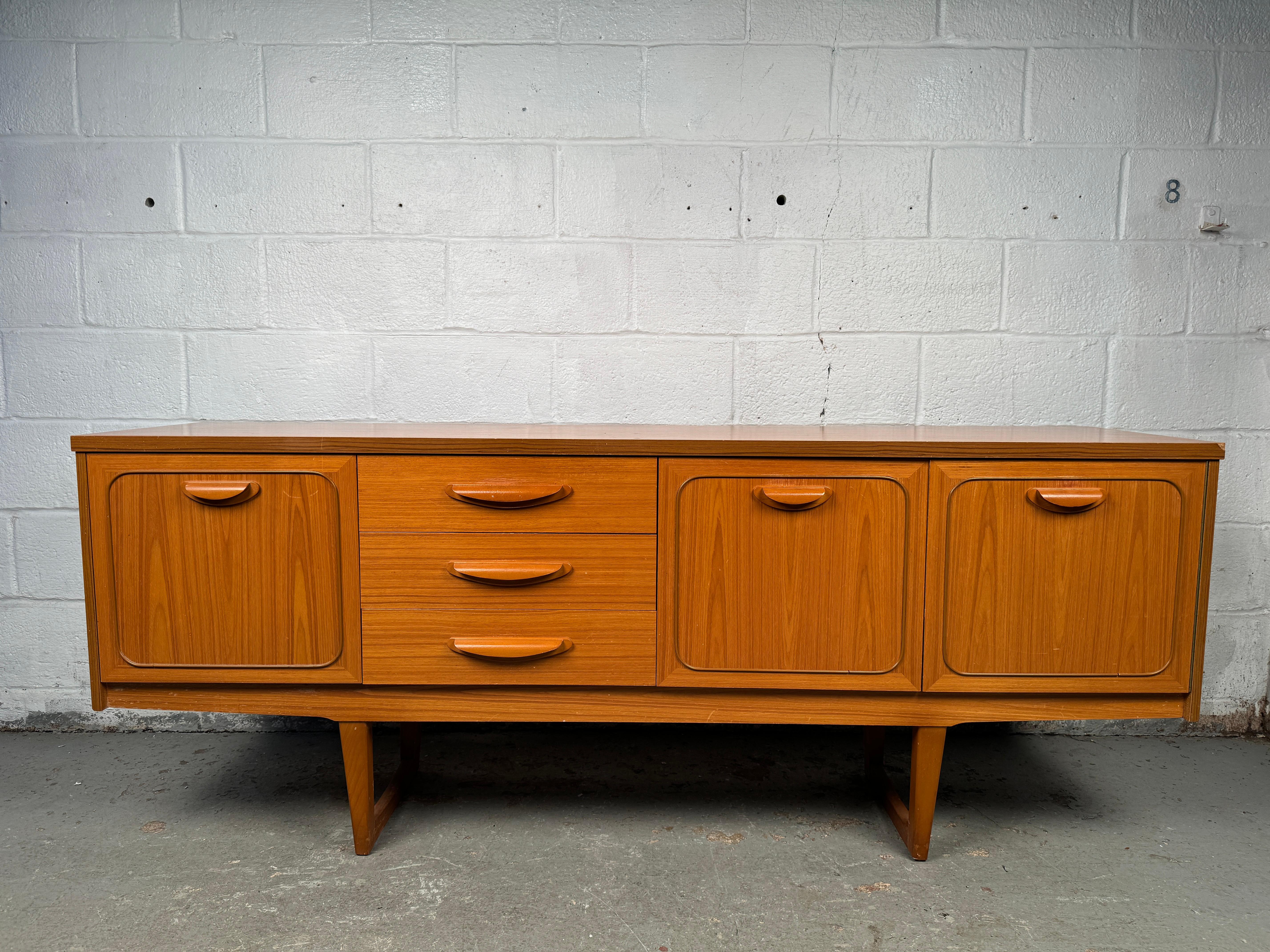 Embodying the clean lines and warm tones of classic mid-century design, this 