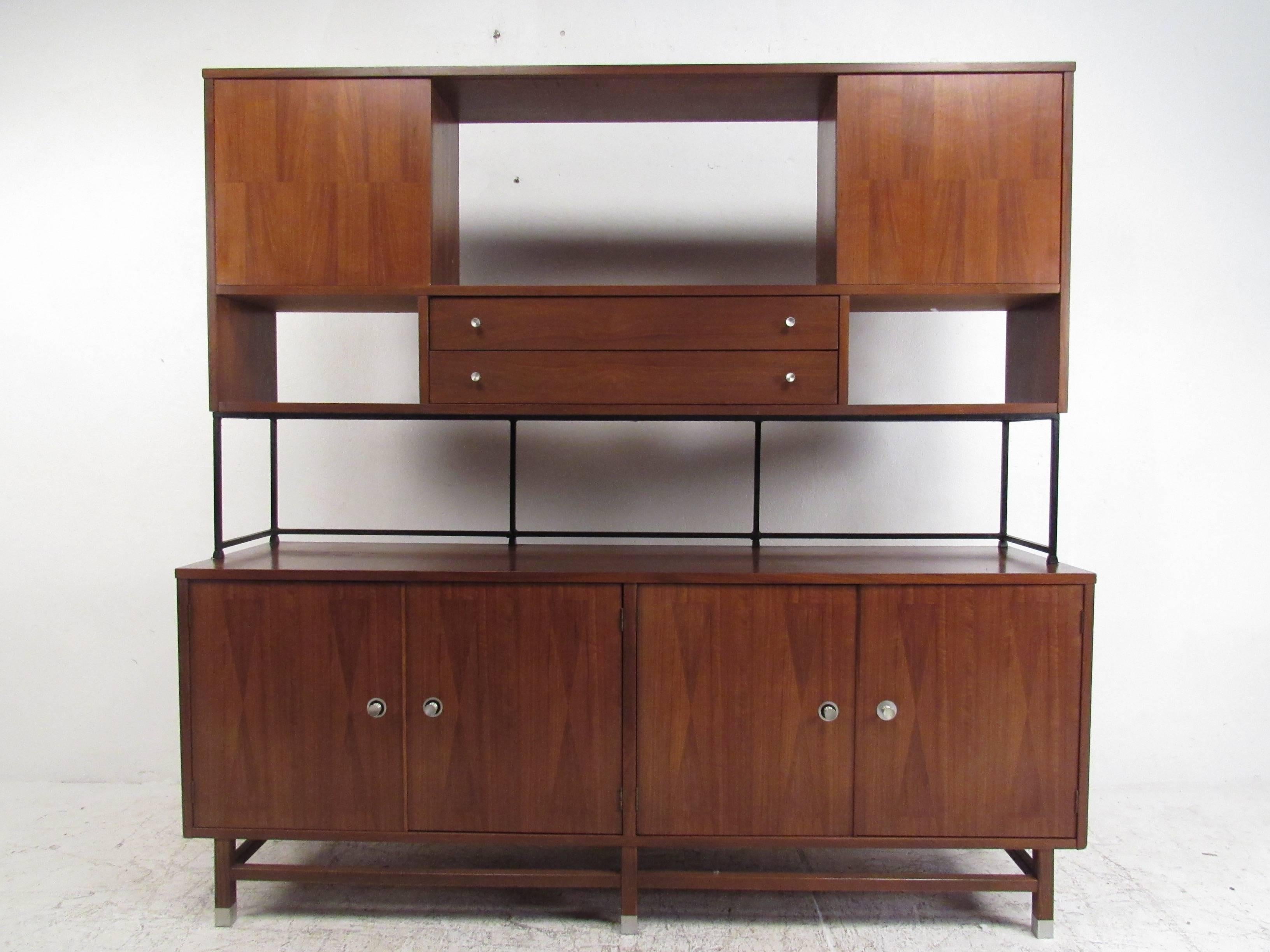 This vintage Stanley credenza features decorative marquetry, unique design details and plenty of space for storage or display. Mid-century design by Stanley furniture mixes quality, style and versatile usability for a variety of settings. Sideboard