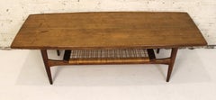 Mid-Century Two Tiered Danish Teak and Wicker Coffee Table