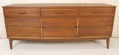 Vintage Nine Drawer Walnut Dresser By Dixie Furniture Co.