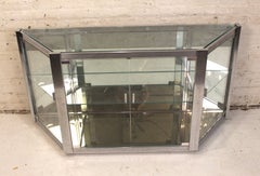 Geometric Glass and Chrome Showcase with Mirrored Panels