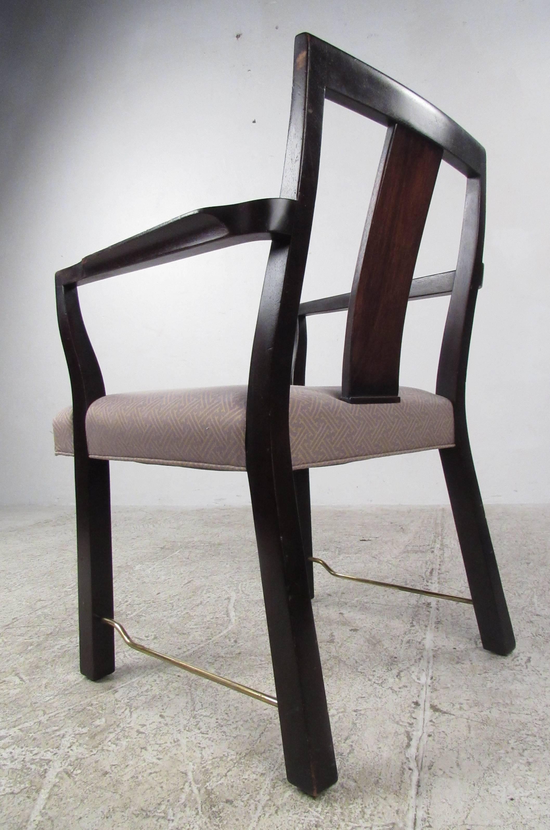Set of six dining chairs designed by Edward Wormley for Dunbar with brass stretchers, mahogany frames and upholstered seats. Stylish and substantial mid-century modern dining room chairs make an elegant edition to any dining room setting. Please