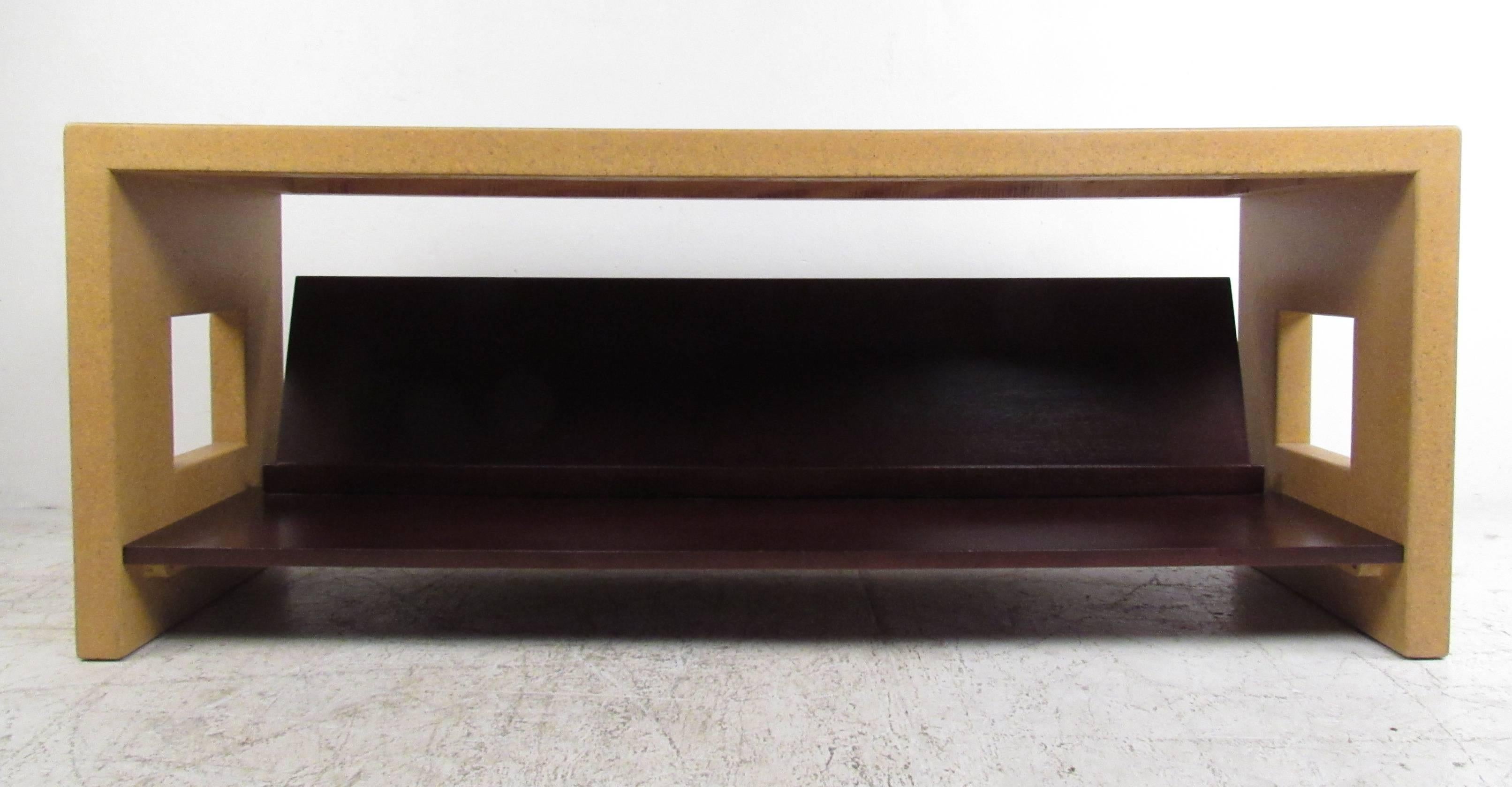 Unique lacquered cork and wood console table with literature shelf by noted American designer Paul Frankl, 1886-1958. Manufacturers stamp.  The understated magnificience of this vintage console by Frankl makes it an appealing view from every angle,