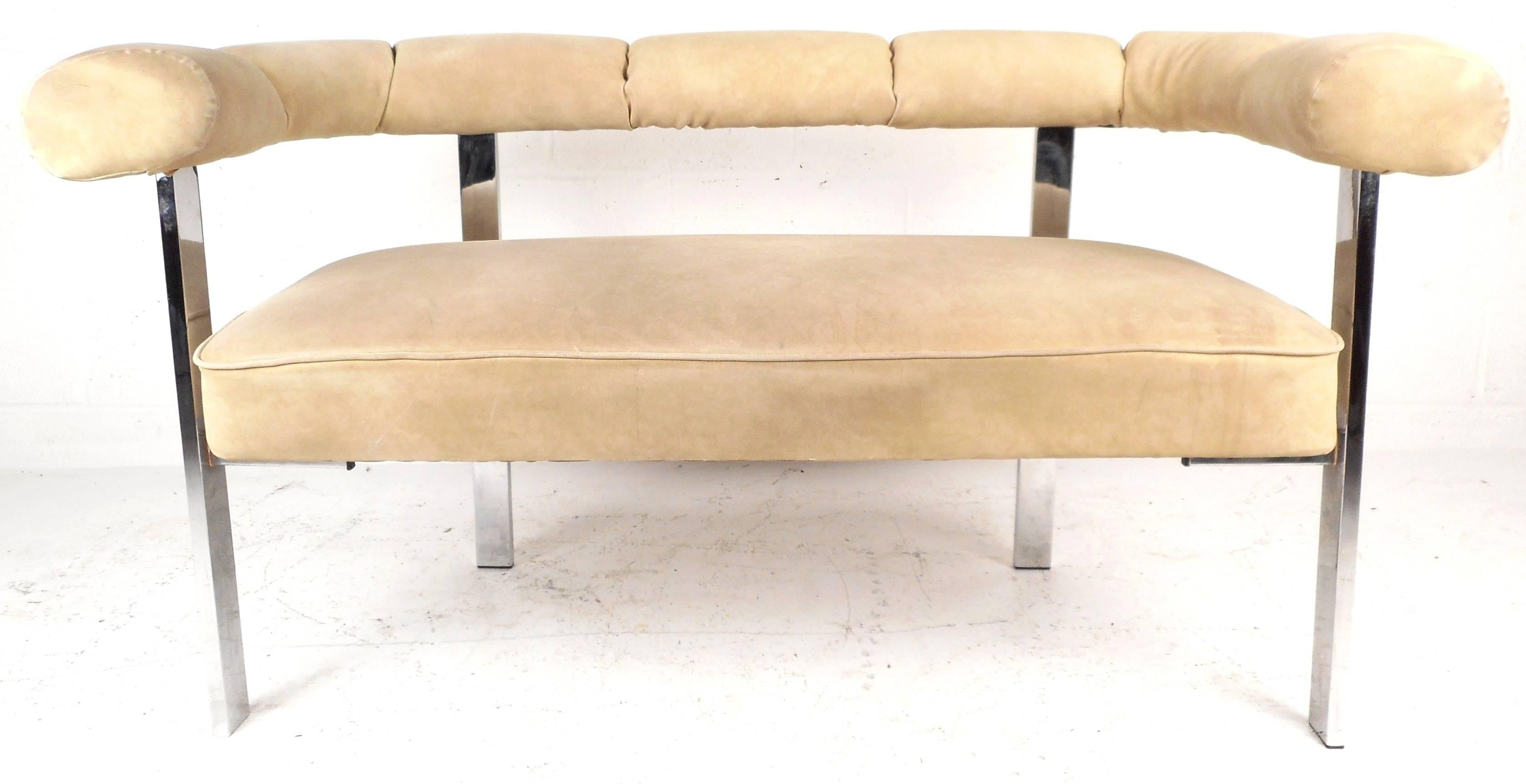 This lovely Mid-Century Modern settee features a plush barrel back that wraps all the way around and a thick chrome frame. The unique design offers comfort and style in any setting. Please confirm item location (NY or NJ).