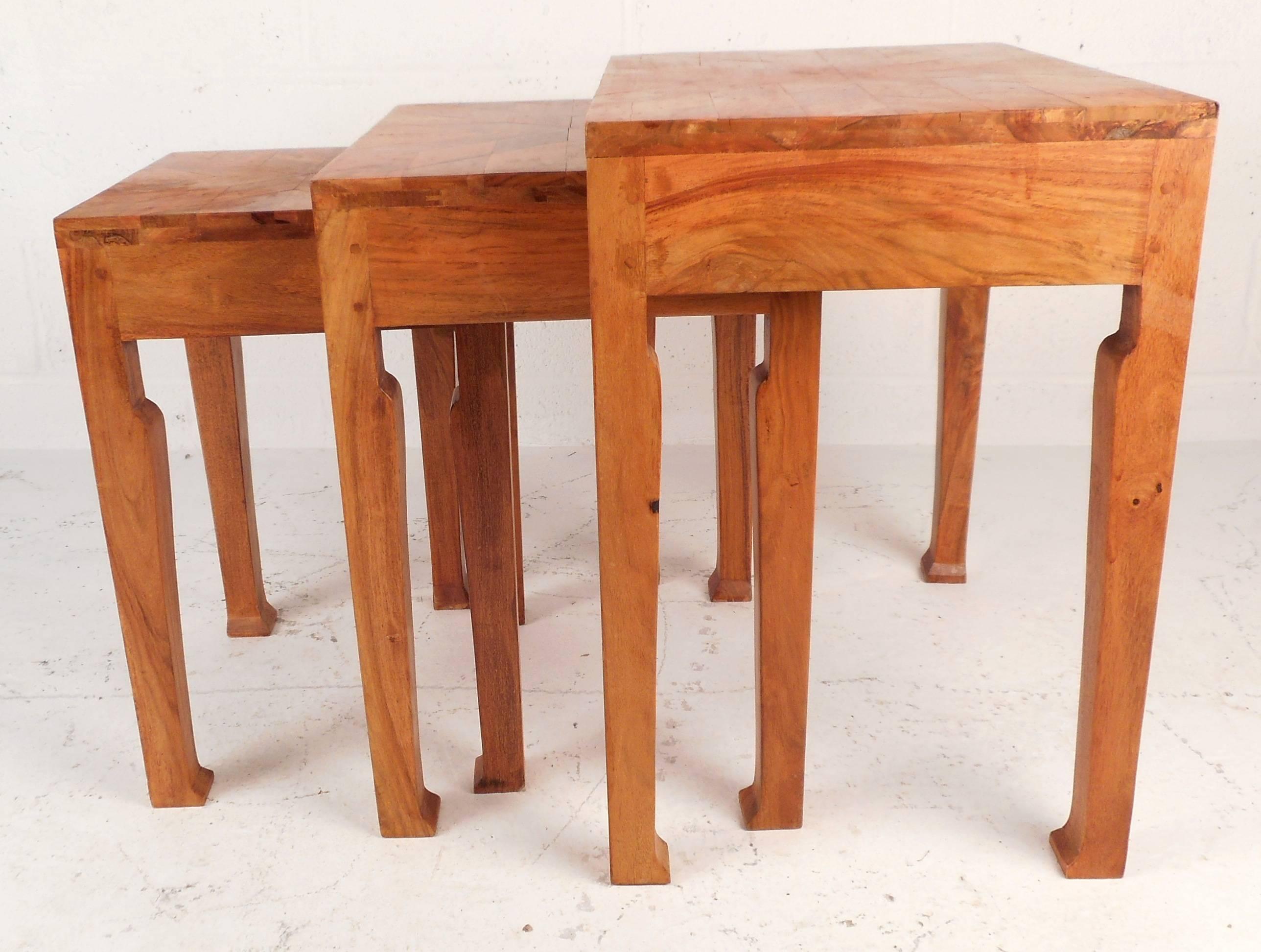 This set of three Mid-Century Modern nesting tables feature sculpted legs and unique marquetry finish throughout. Please confirm item location (NY or NJ).
Dimensions: 21 W 15 D 22.25 H, 17 W 13.5 D 20.75 H, 13 W 12.5 D 19 H.
      