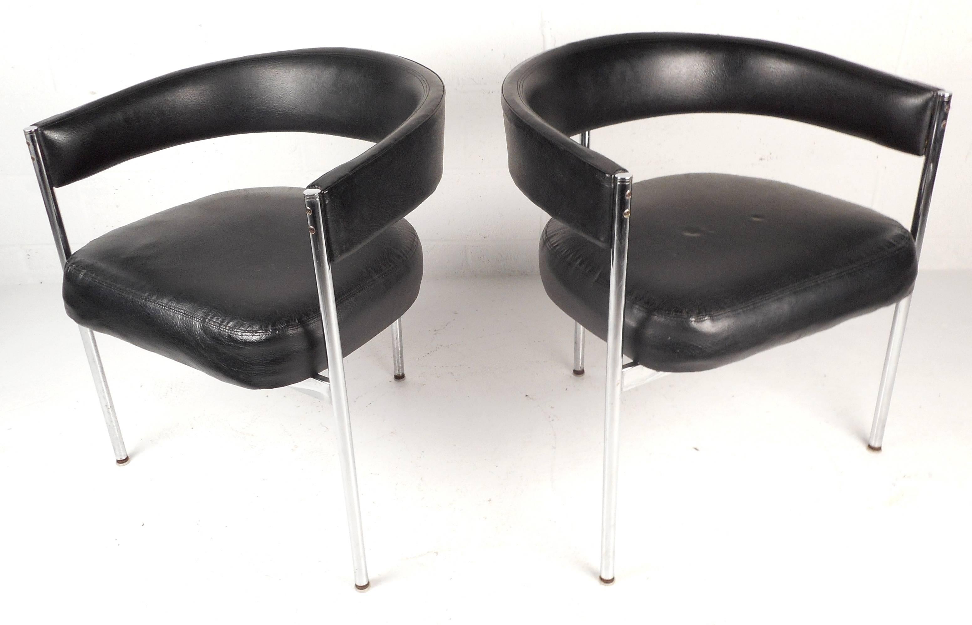 Divine pair of Mid-Century chrome and vinyl chairs with a three legged frame and a comfortable wrap around barrel backrest. The unique design was made by, 