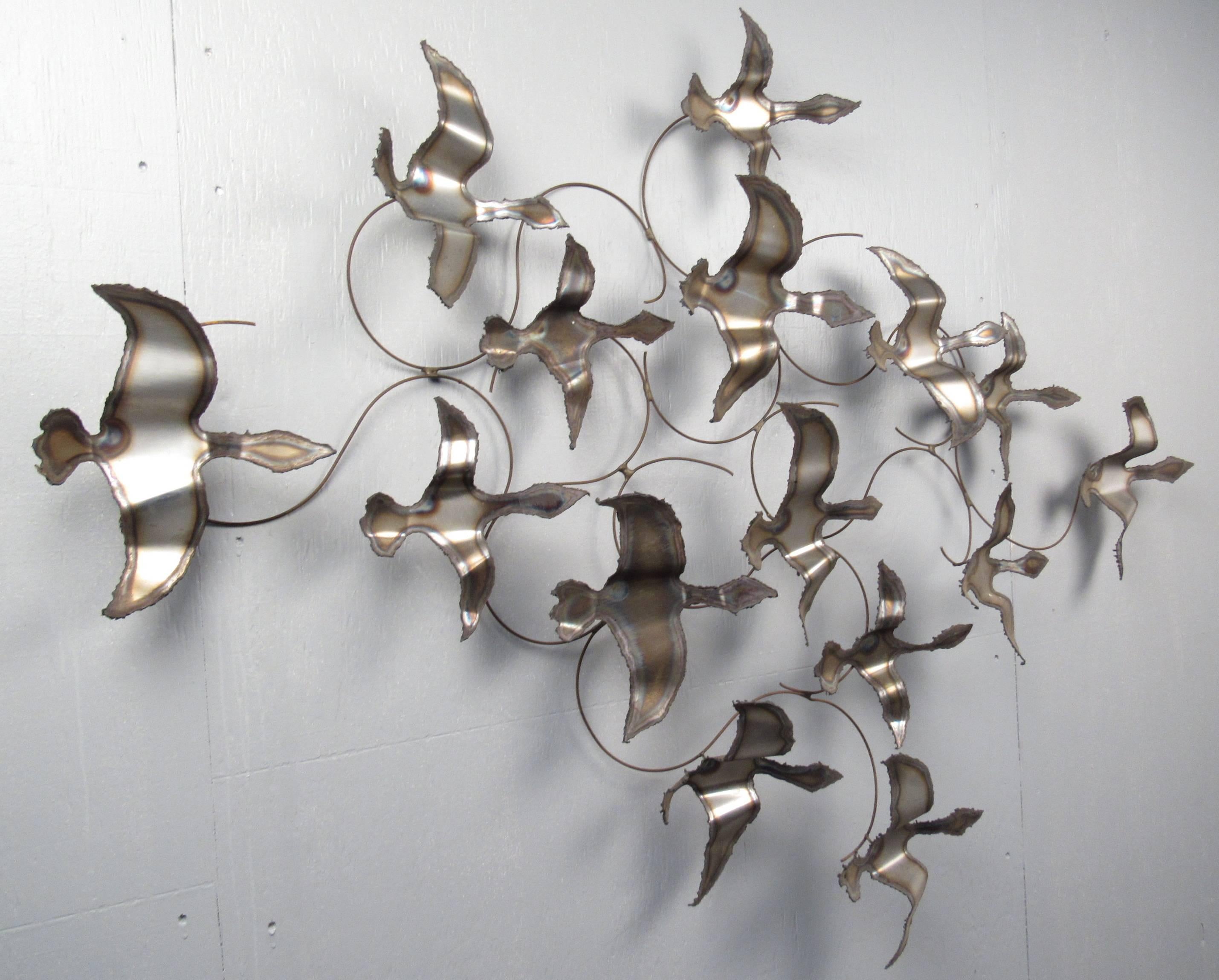 Large, decorative wall relief of birds in flight made from bent and braised metal. Please confirm item location (NY or NJ) with dealer.
