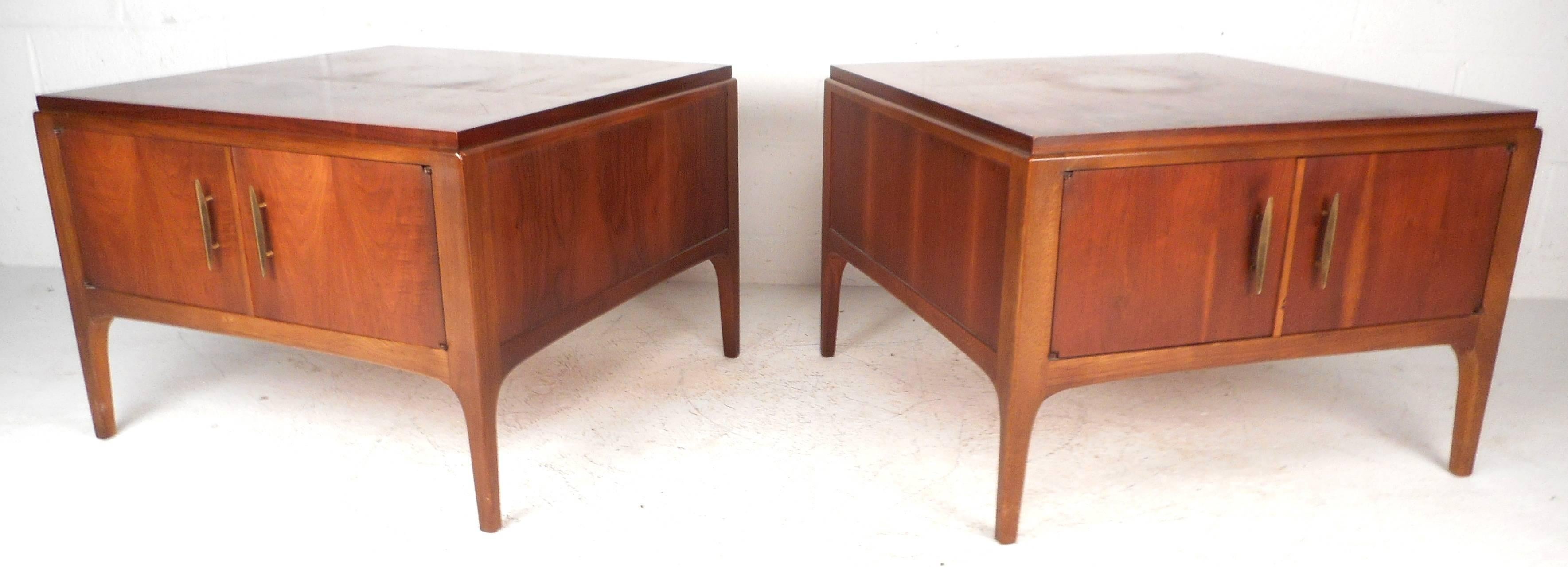 Impressive Mid-Century pair of Lane end tables feature sculpted brass pulls and finished backs. The oversized design offers a variety of uses and leaves plenty of room for storage. The beautiful two-tone style has vintage walnut and oak finish