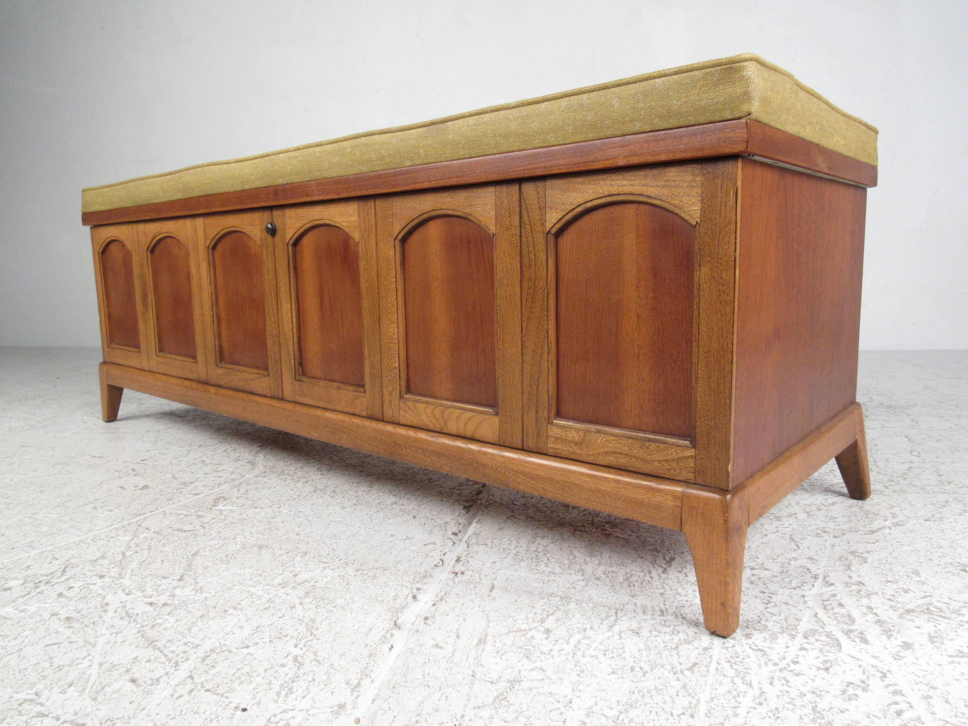 Rare blanket chest by Lane featuring vinyl tufted upholstered seat and oak and walnut exterior with cedar lined interior. Please confirm item location (NY or NJ) with dealer.