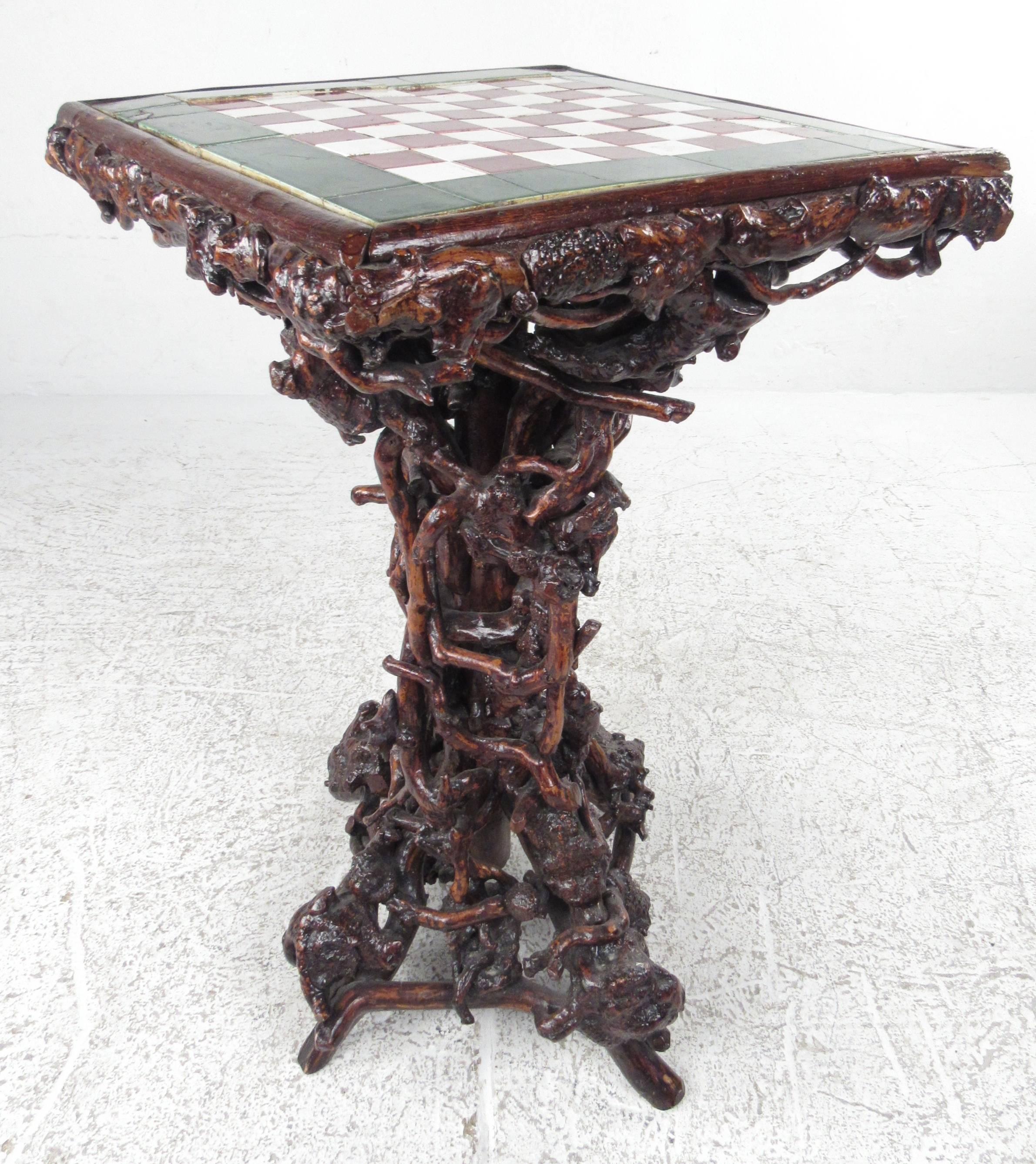 Elaborate tangled twig and root base supporting a square ceramic tile chessboard top. Please confirm item location (NY or NJ) with dealer.