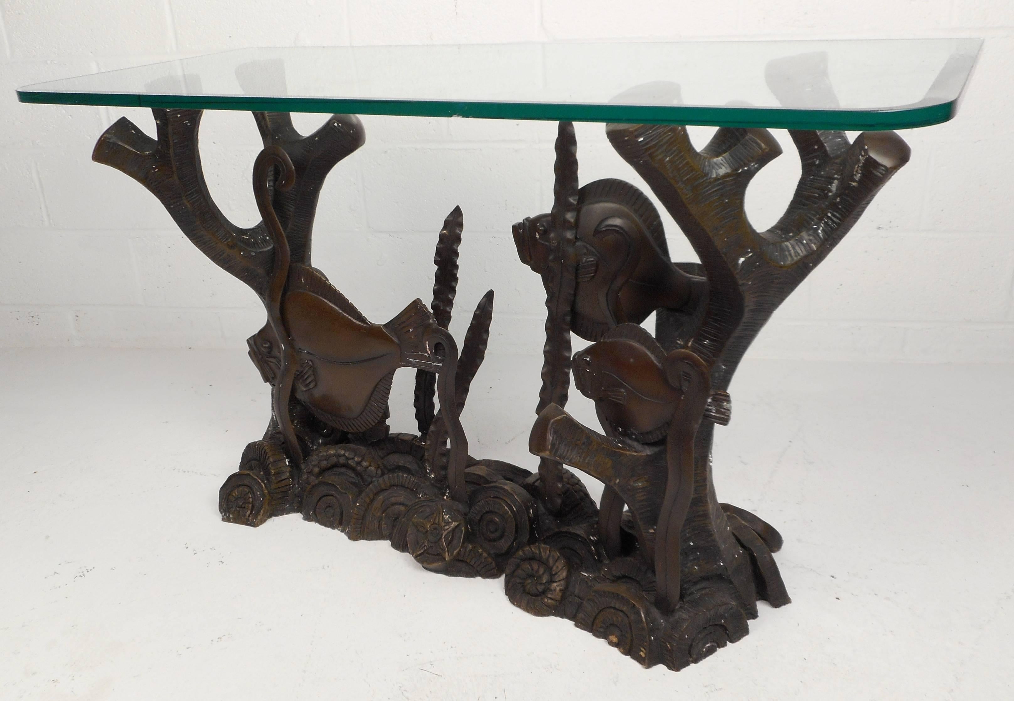 This stunning vintage bronze console table features a unique 