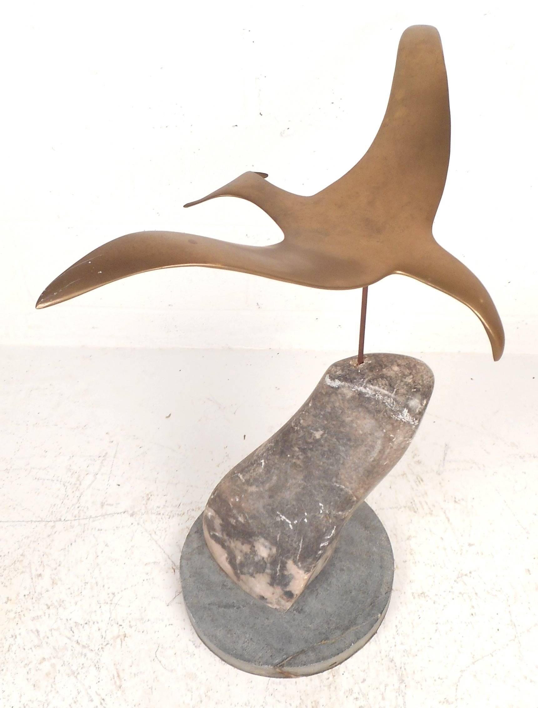 Gorgeous vintage modern sculpture features a heavy solid brass seagull sitting on top of a thick marble slab. The sturdy round marble base and detailed design show quality craftsmanship making it the perfect addition to any modern interior. Please