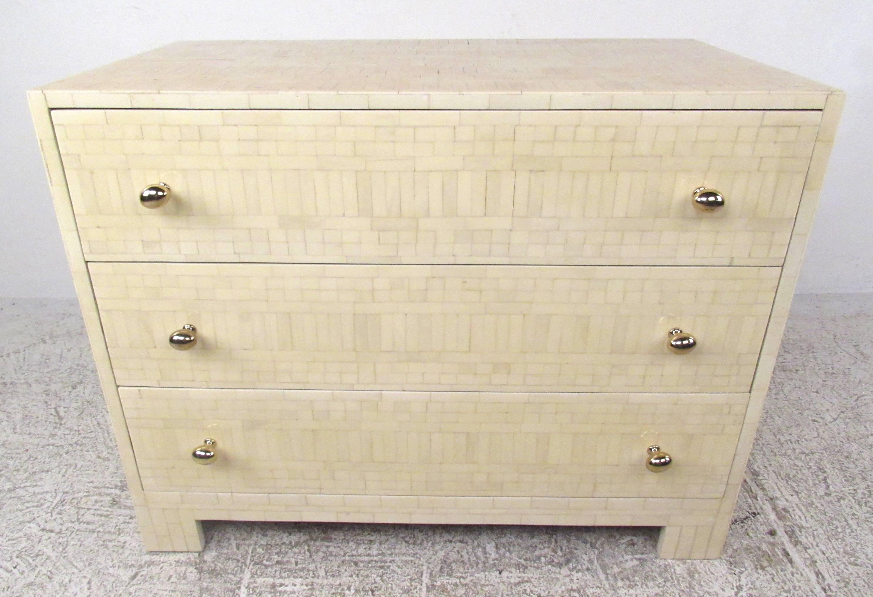 Elaborately patterned three-drawer dresser with brass plated pulls attributed to Enrique Garcel. Please confirm item location (NY or NJ) with dealer.