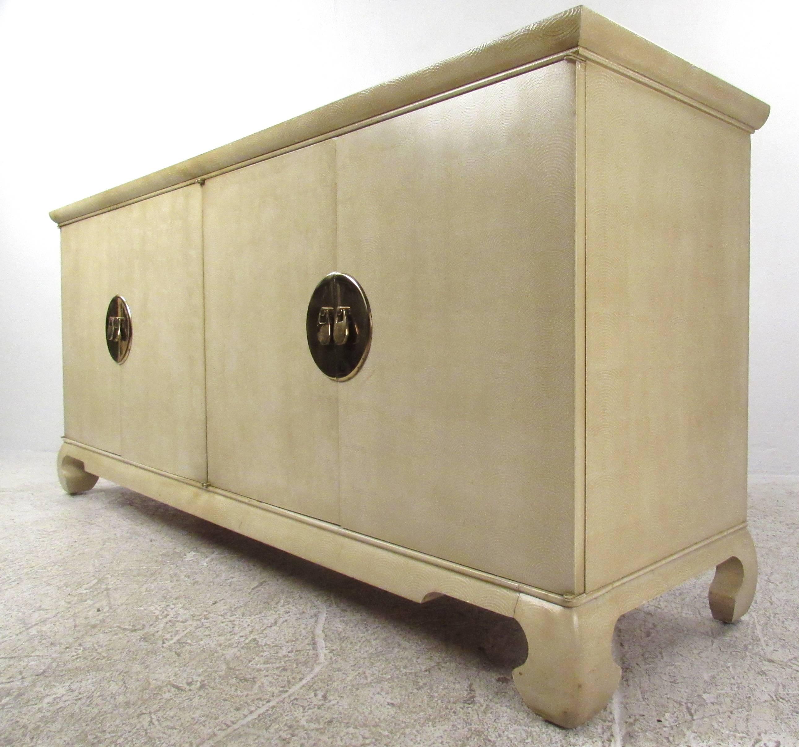 Vintage four-door Heritage Connoisseur sideboard with Asian influenced Chinoiserie styling, beautifully textured finish, and impressive brass hardware. Please confirm item location (NY or NJ) with dealer.