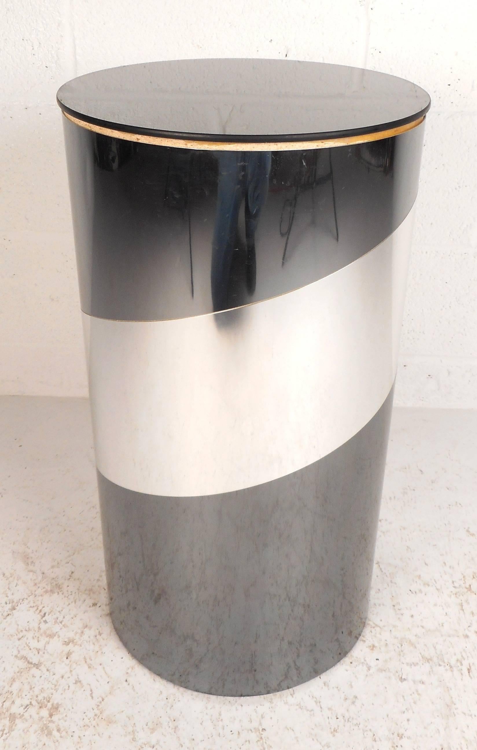 Stunning vintage modern pedestal features a cylinder shape layered with chrome strips and a mirrored top. Unique design can be used for a side table or a decorative piece. The Classic retro appearance makes it the perfect addition to any modern