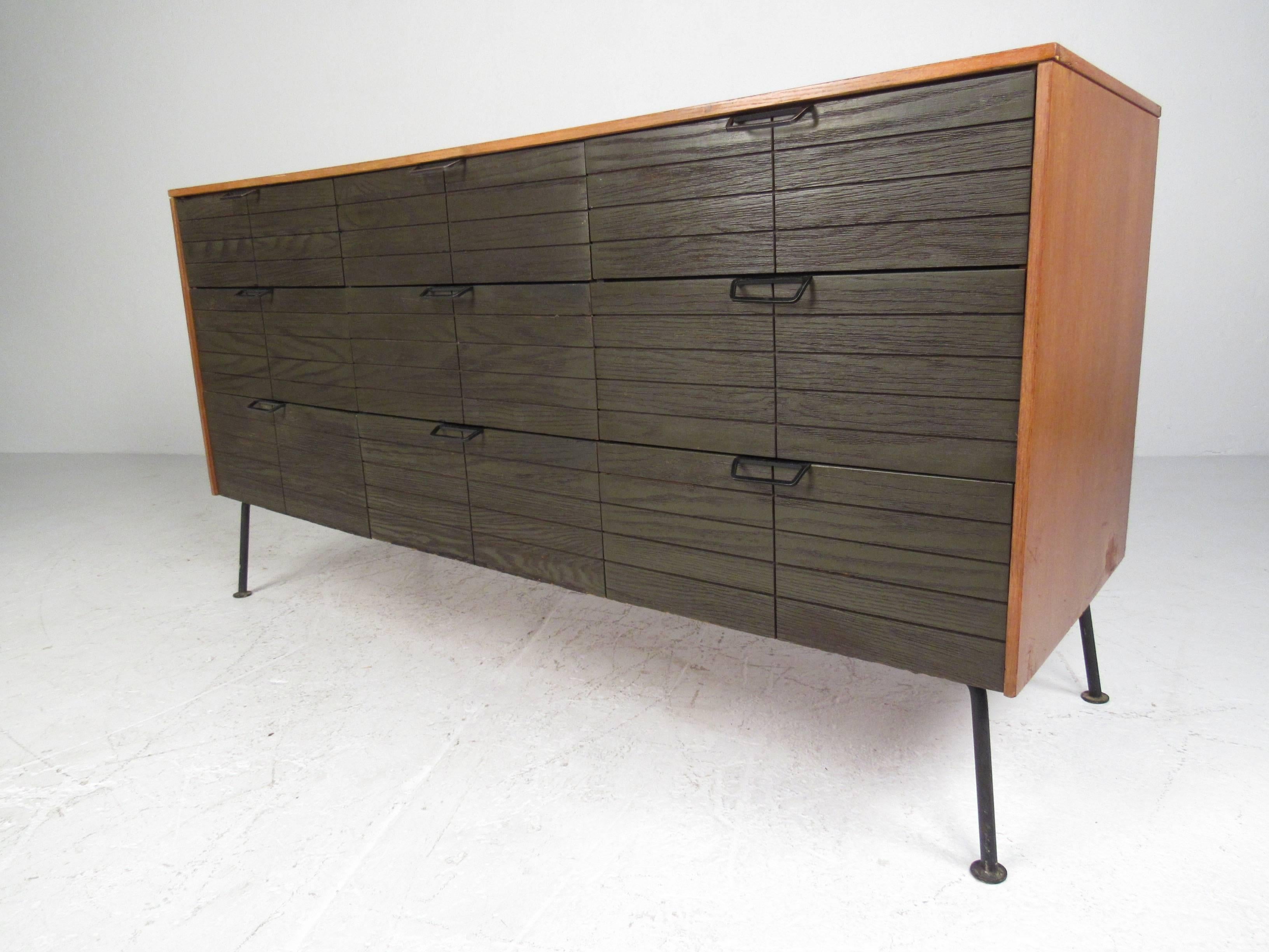 Rare nine-drawer dresser with vanity mirror designed by Raymond Loewy for the Mengel Furniture Company. 
Please confirm item location (NY or NJ). 