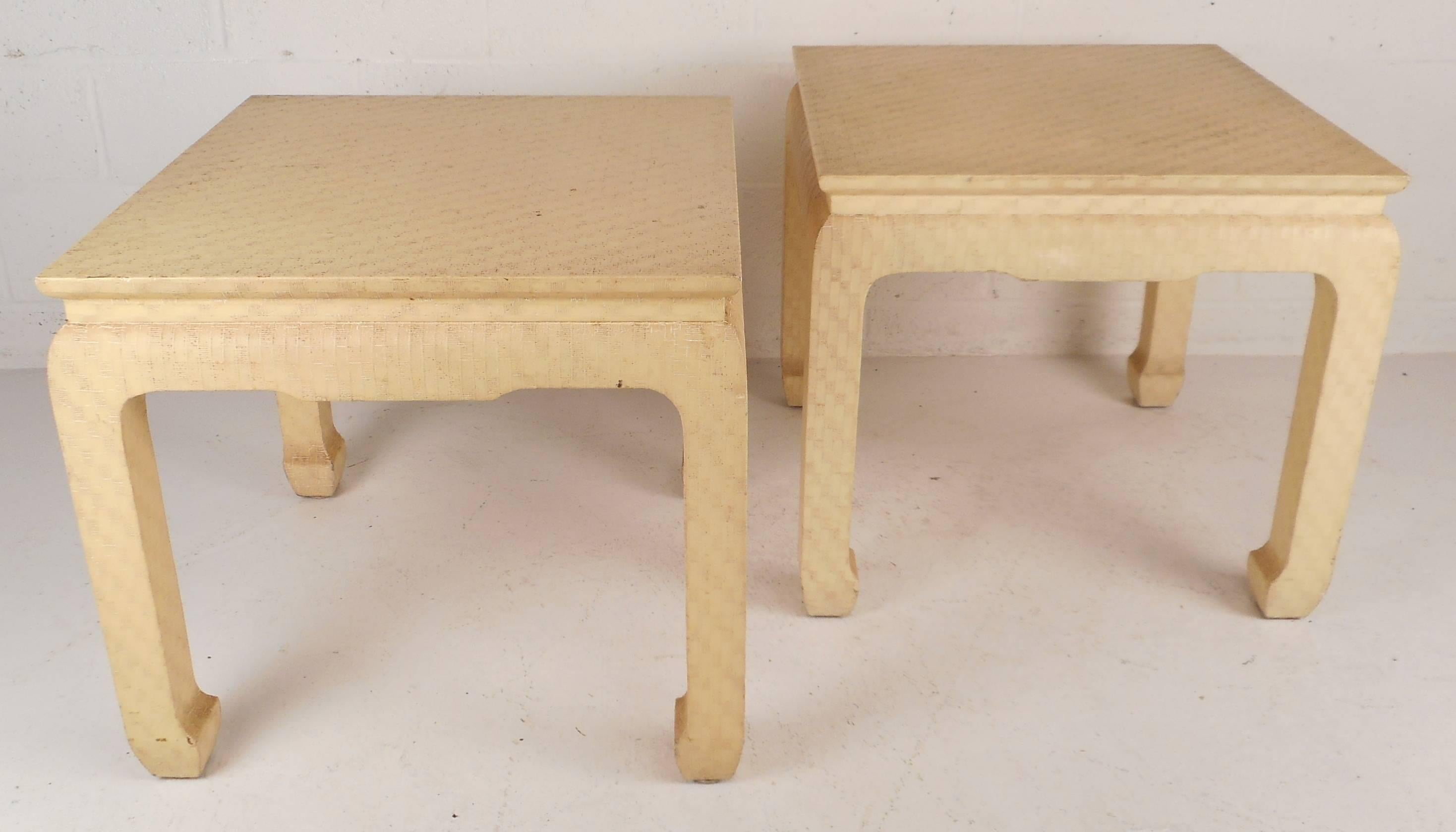 Stunning pair of vintage modern Asian style end tables covered in lacquered grass cloth. Stylish design features sculpted legs and a raised top showing quality craftsmanship at its best. Perfect addition to any home, business, or office. Please